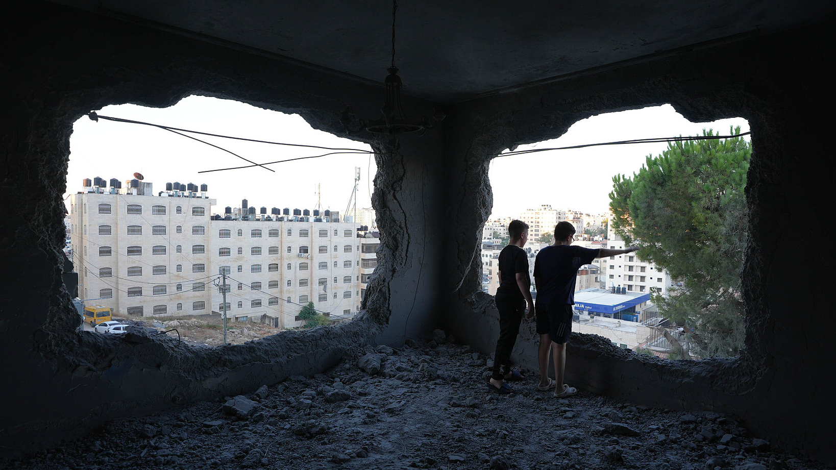 Palestinians inspect the demolished building after Israeli soldiers raided West Bank cities of Ramallah and Al-Bireh and demolished the houses in Ramallah, West Bank, August 13, 2024. /CFP