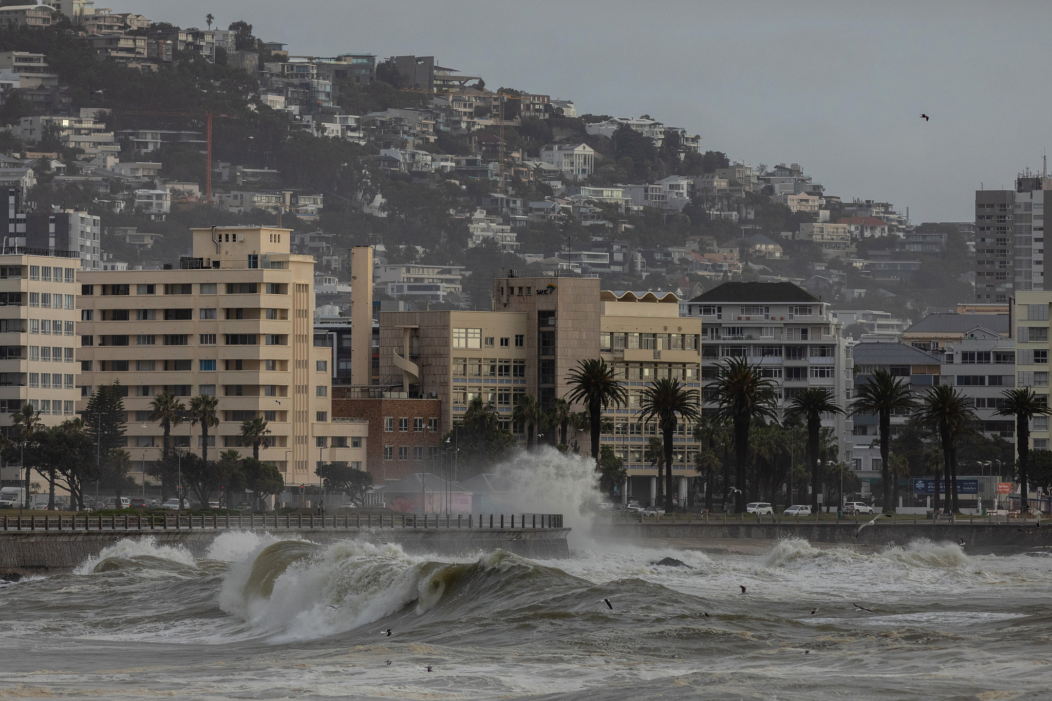 Stormy seas near residential buildings in the Sea Point suburb of Cape Town, South Africa, July 11, 2024. /CFP