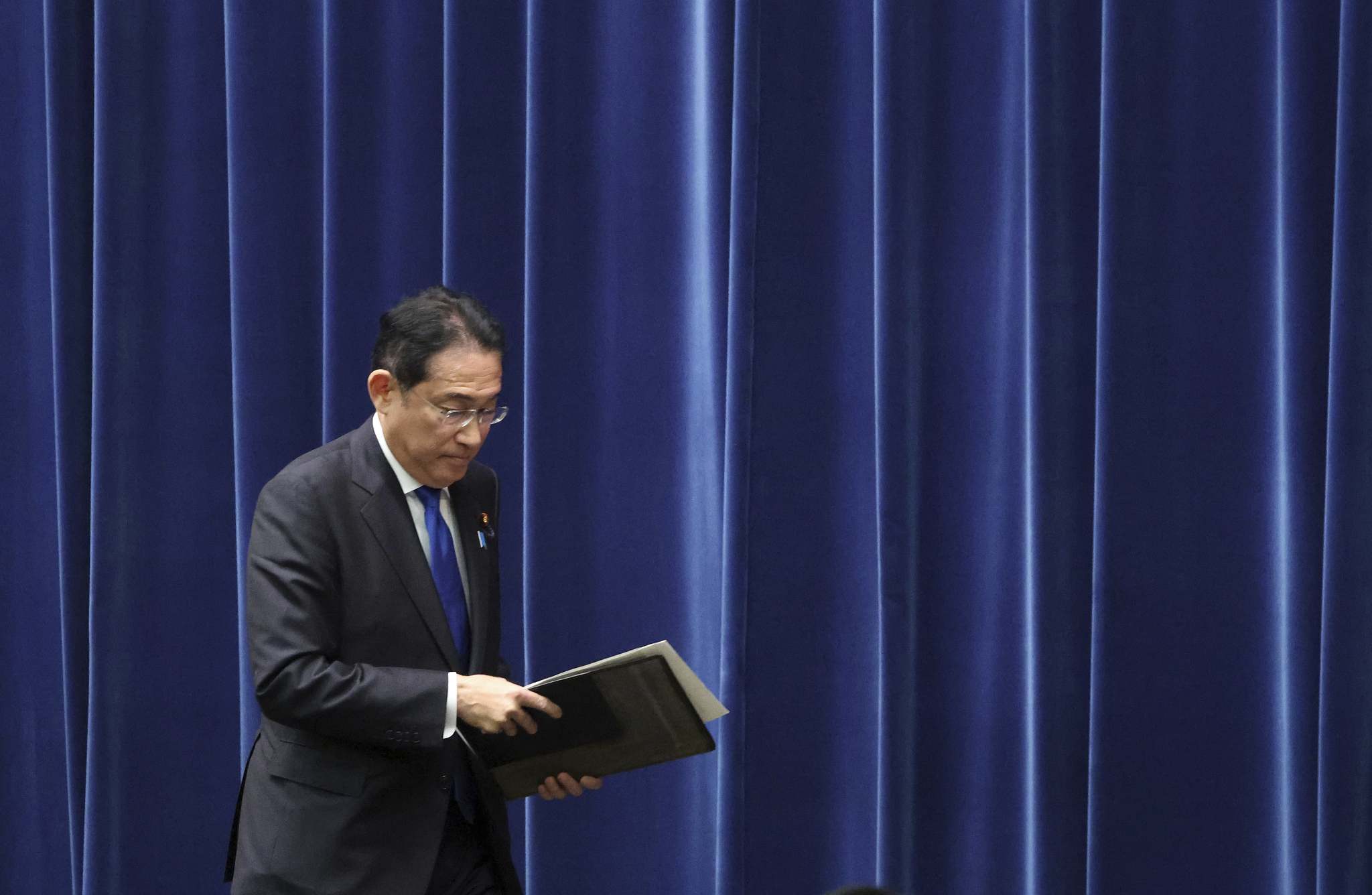 Japan's Prime Minister Fumio Kishida leaves after attending a press conference at the Prime Minister's office in Tokyo on August 14, 2024. /CFP