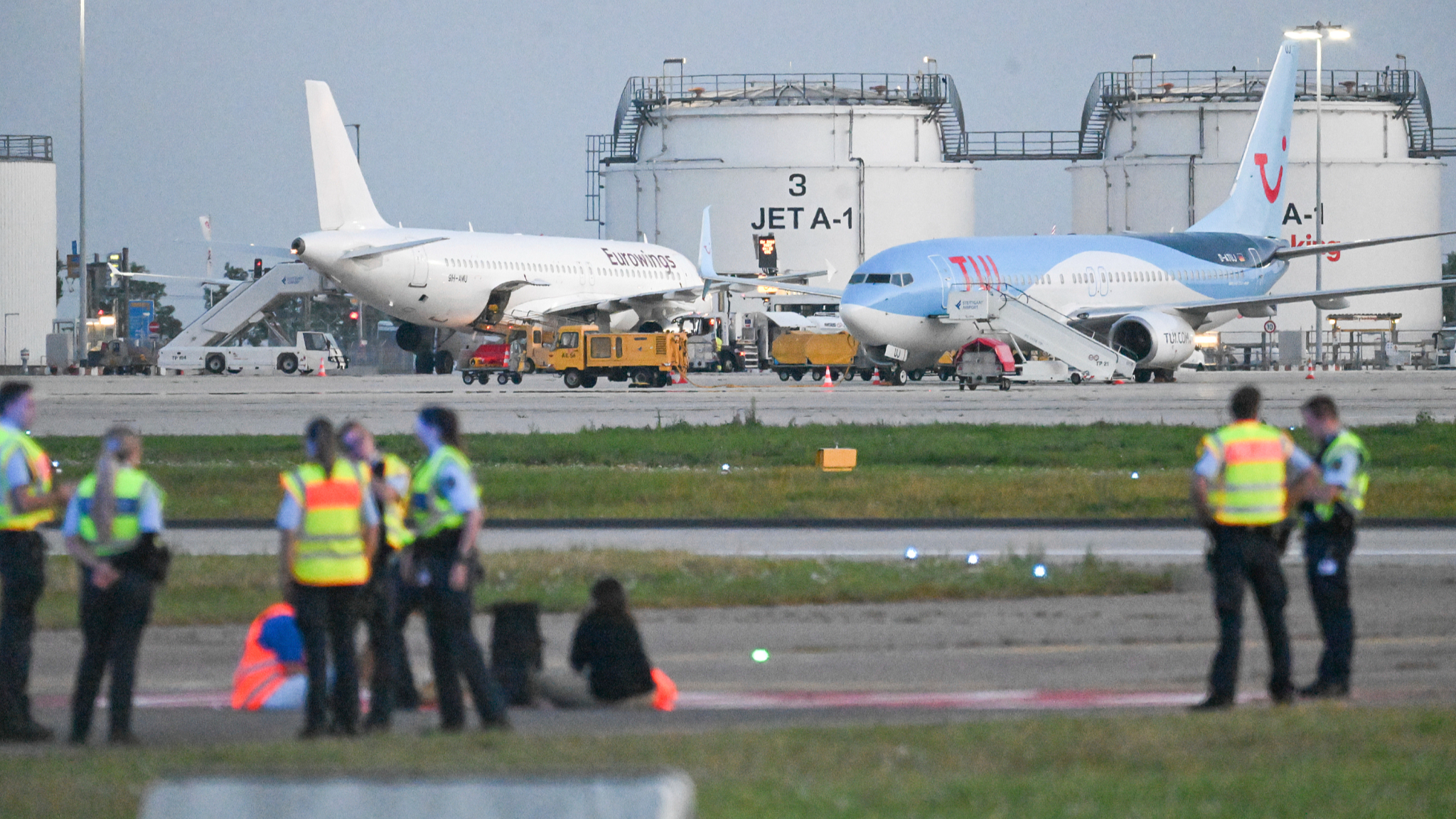 Climate activists on a tarmac at Stuttgart Airport, Stuttgart, Germany, August 15, 2024. /CFP