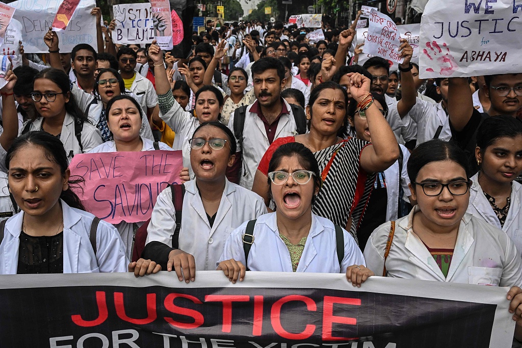 Medical professionals and activists protest to condemn the rape and murder of a young medic, in Kolkata, India on August 14, 2024. /CFP