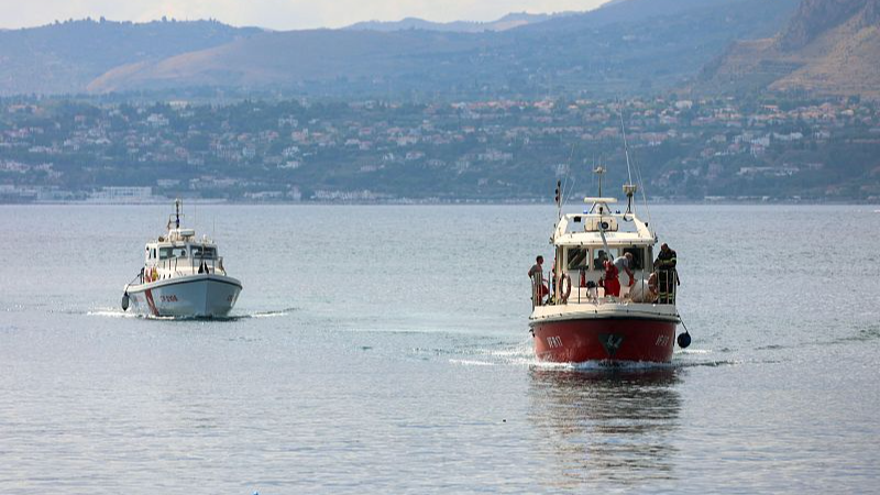 A coast guard boat and an Italian fireboat search for six missing following the recovery of a victim after the sailboat they were in sank off the coast of Porticello, northwest of Sicily Island, August 19, 2024. /CFP