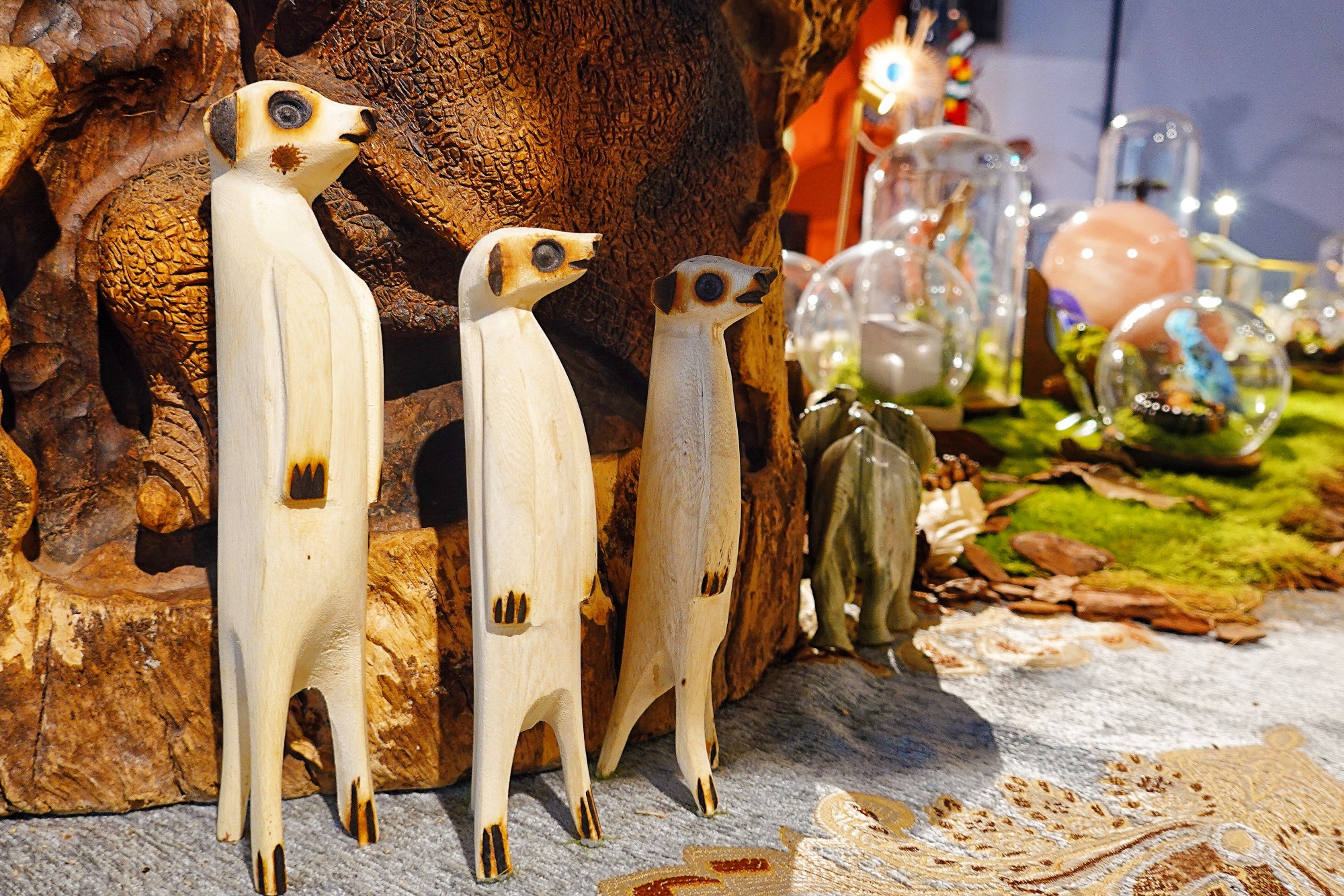 Wooden meerkat statuettes are seen on display at Apex African Art Gallery in Beijing on August 7, 2024. /CGTN