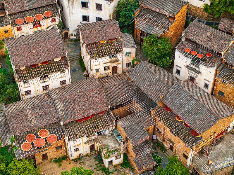 Villagers dry food in their backyards in Huangling Village, Wuyuan County, Jiangxi Province, August 18, 2024. /CFP