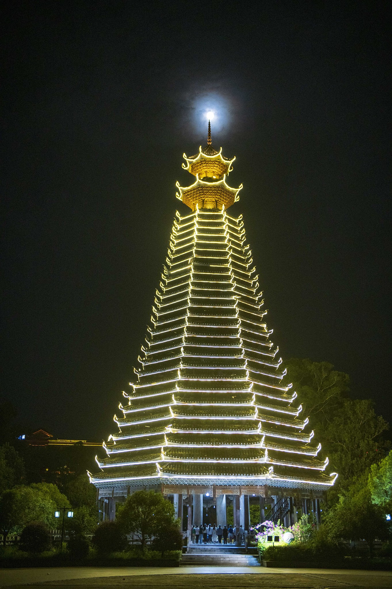 The supermoon is captured over a drum tower in Congjiang County, Guizhou Province on August 19, 2024. /CFP