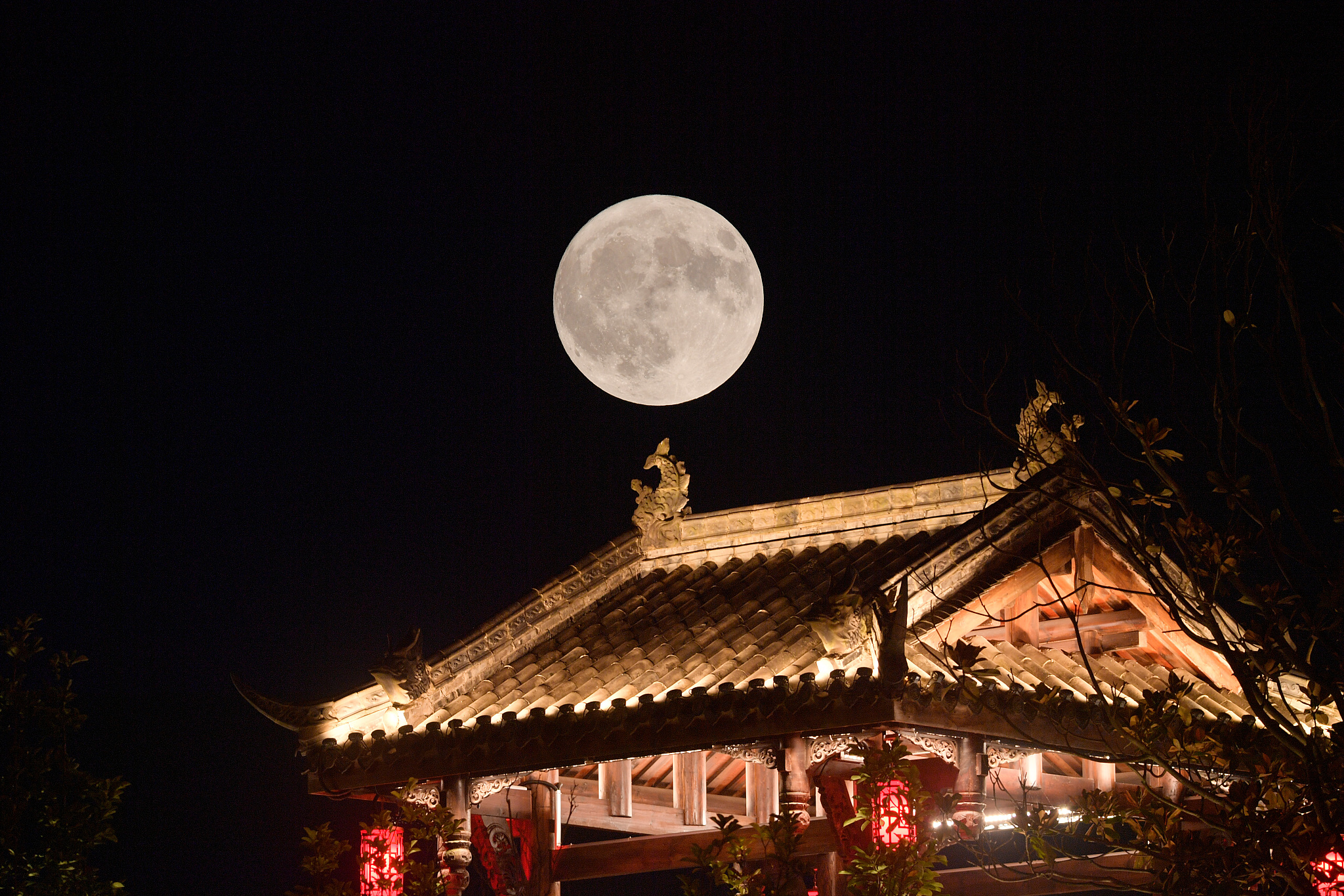 A double exposure photo shows the supermoon illuminating the sky over Guang'an, Sichuan Province on August 19, 2024. /CFP