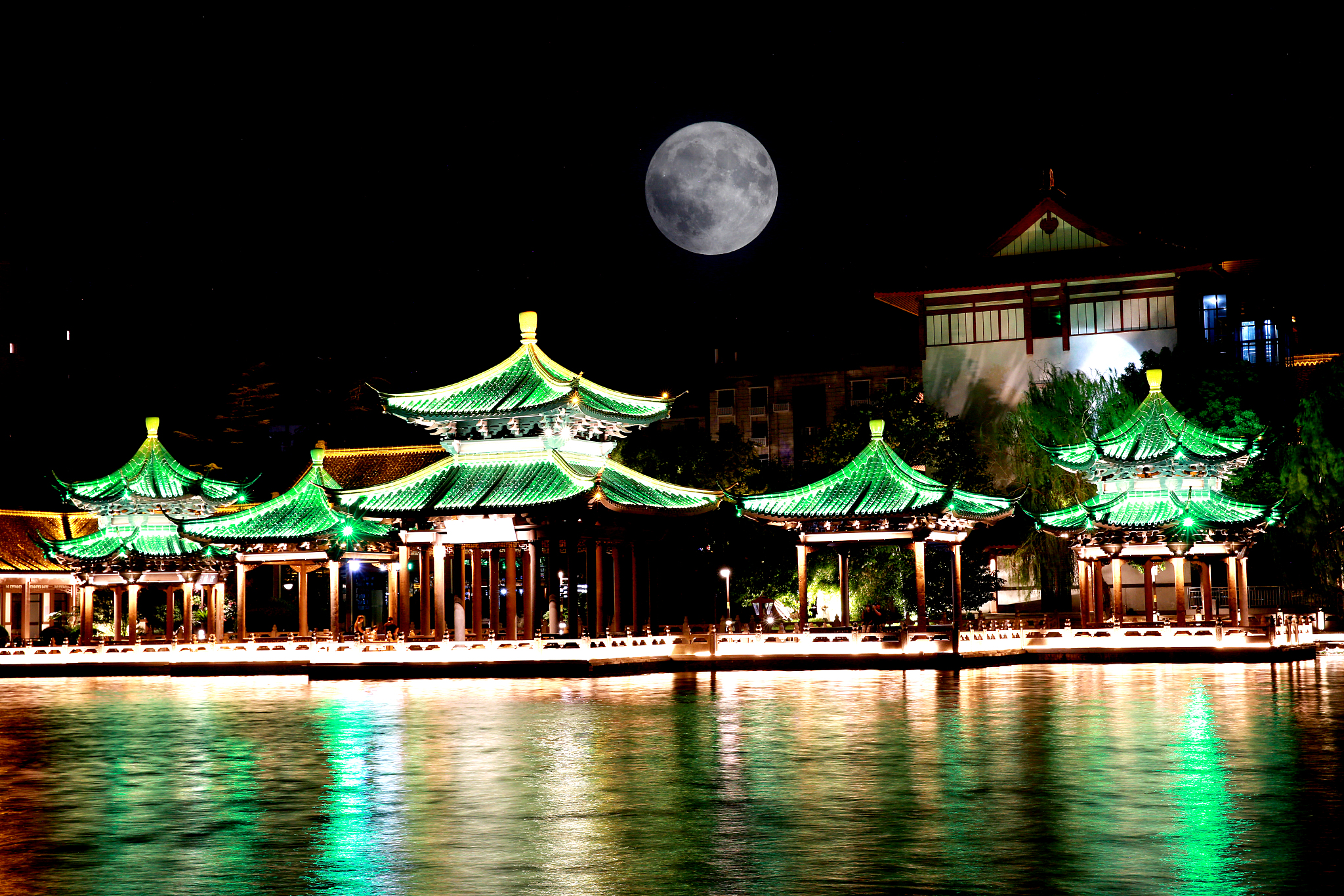 A multiple exposure photo shows the supermoon illuminating the sky over Nantong, Jiangsu Province on August 19, 2024. /CFP