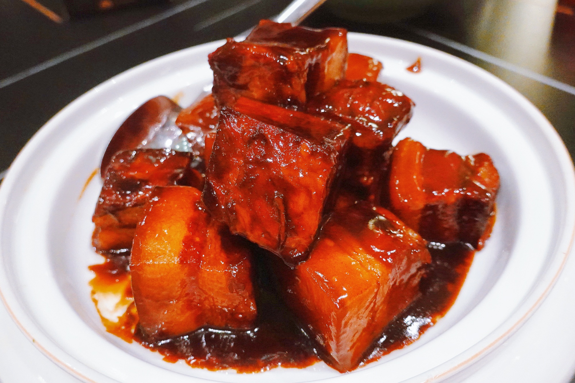 Braised pork cubes are a popular dish in Jiangsu Province. The thick red braising sauce is made with caramelized rock sugar, and soy sauce. /CGTN