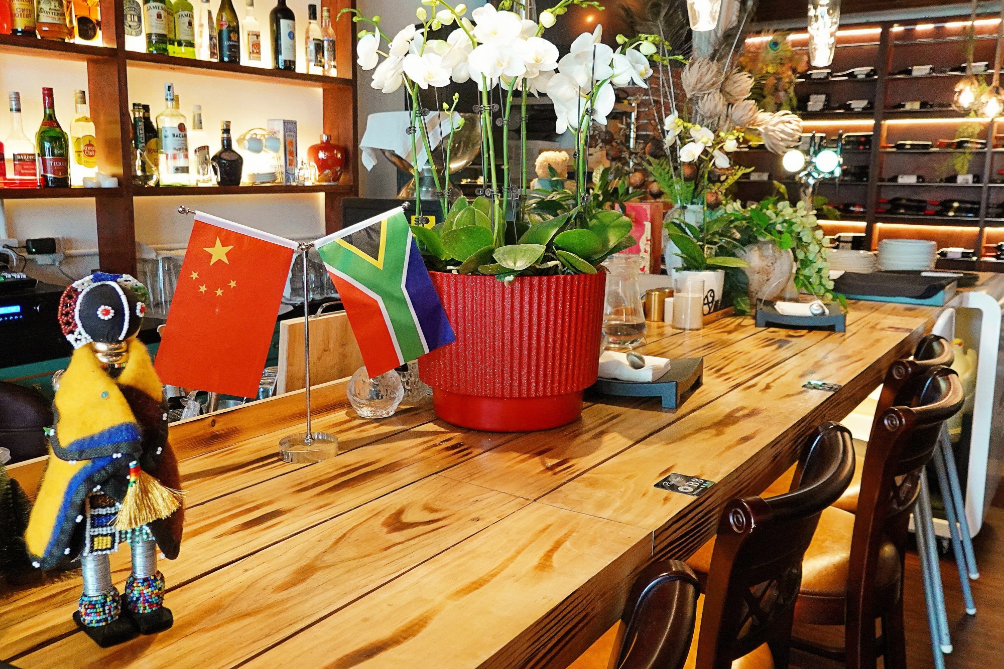 A South African-themed craft doll is seen on a counter in Pinotage in Beijing on August 6, 2024. /CGTN