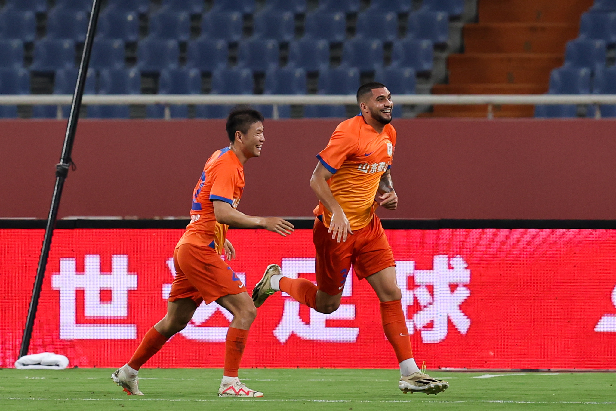 Shandong Taishan players celebrate after scoring a goal in the Chinese Football Association Cup quarterfinals against Henan in Jinan, east China's Shandong Province, August 21, 2024. /CFP