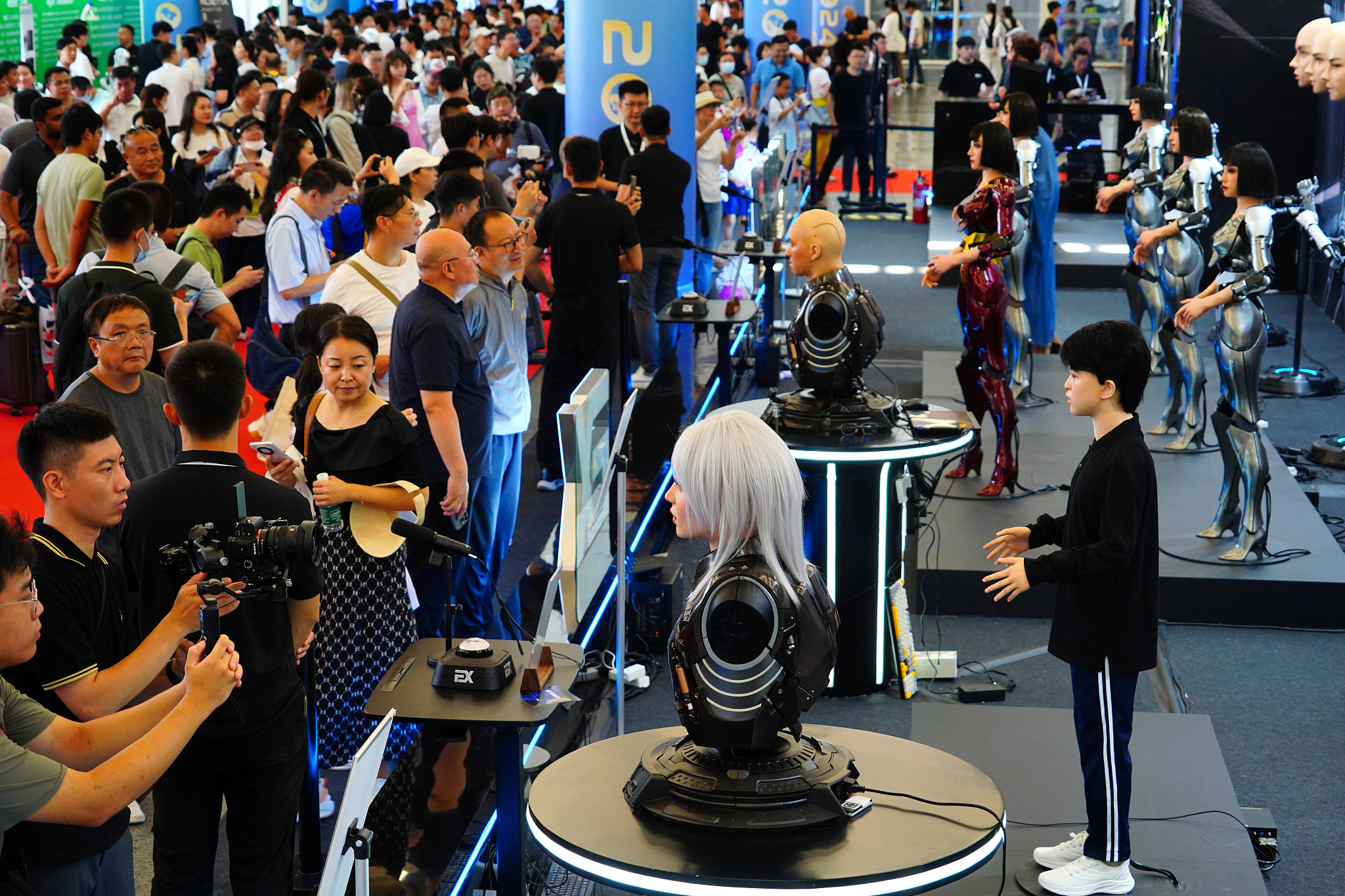 Visitors check out humanoid robots at the 2024 World Robot Conference in Beijing, China, August 22, 2024. /CFP