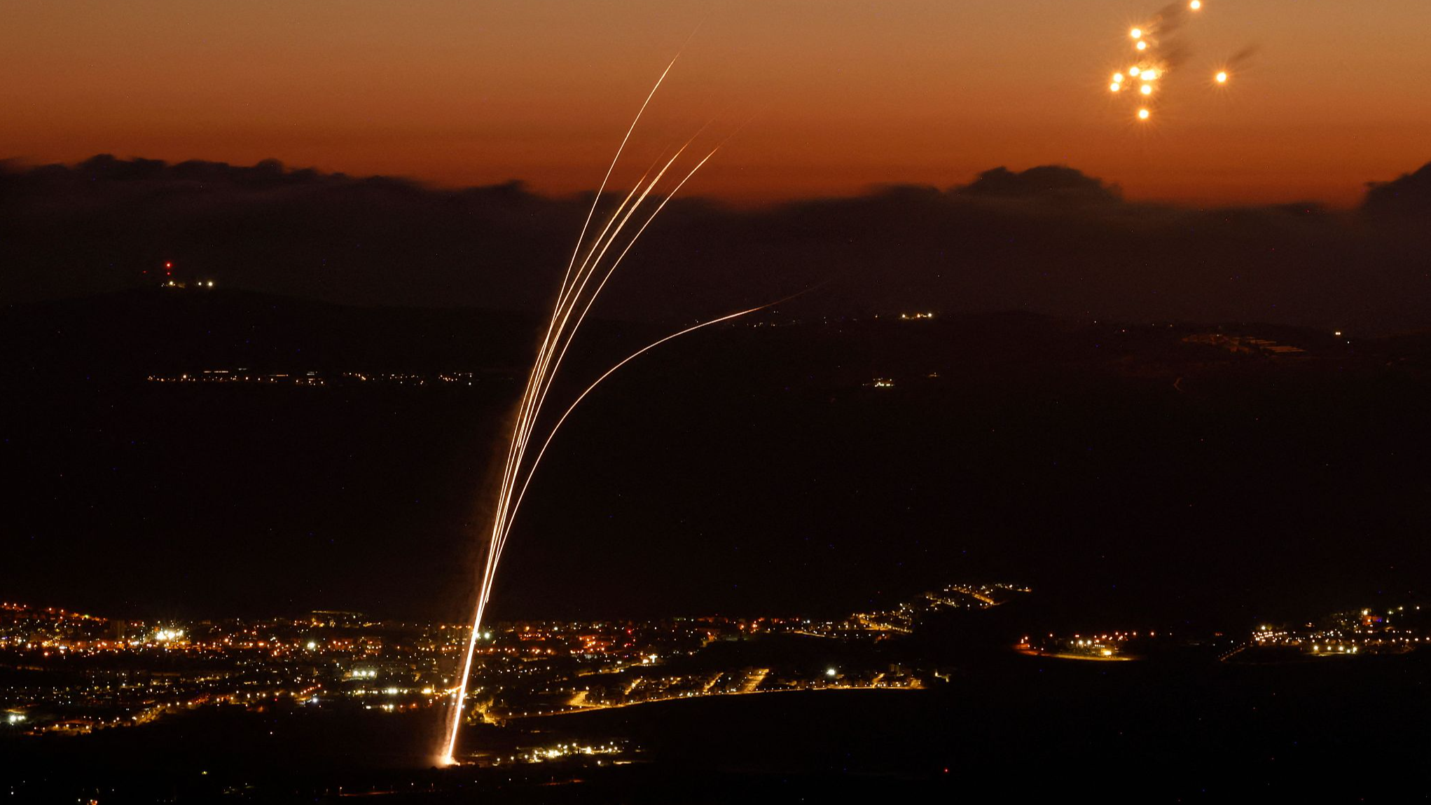 Rockets fired from southern Lebanon are intercepted by Israel's Iron Dome air defense system over the Upper Galilee region in northern Israel, August 23, 2024. /CFP