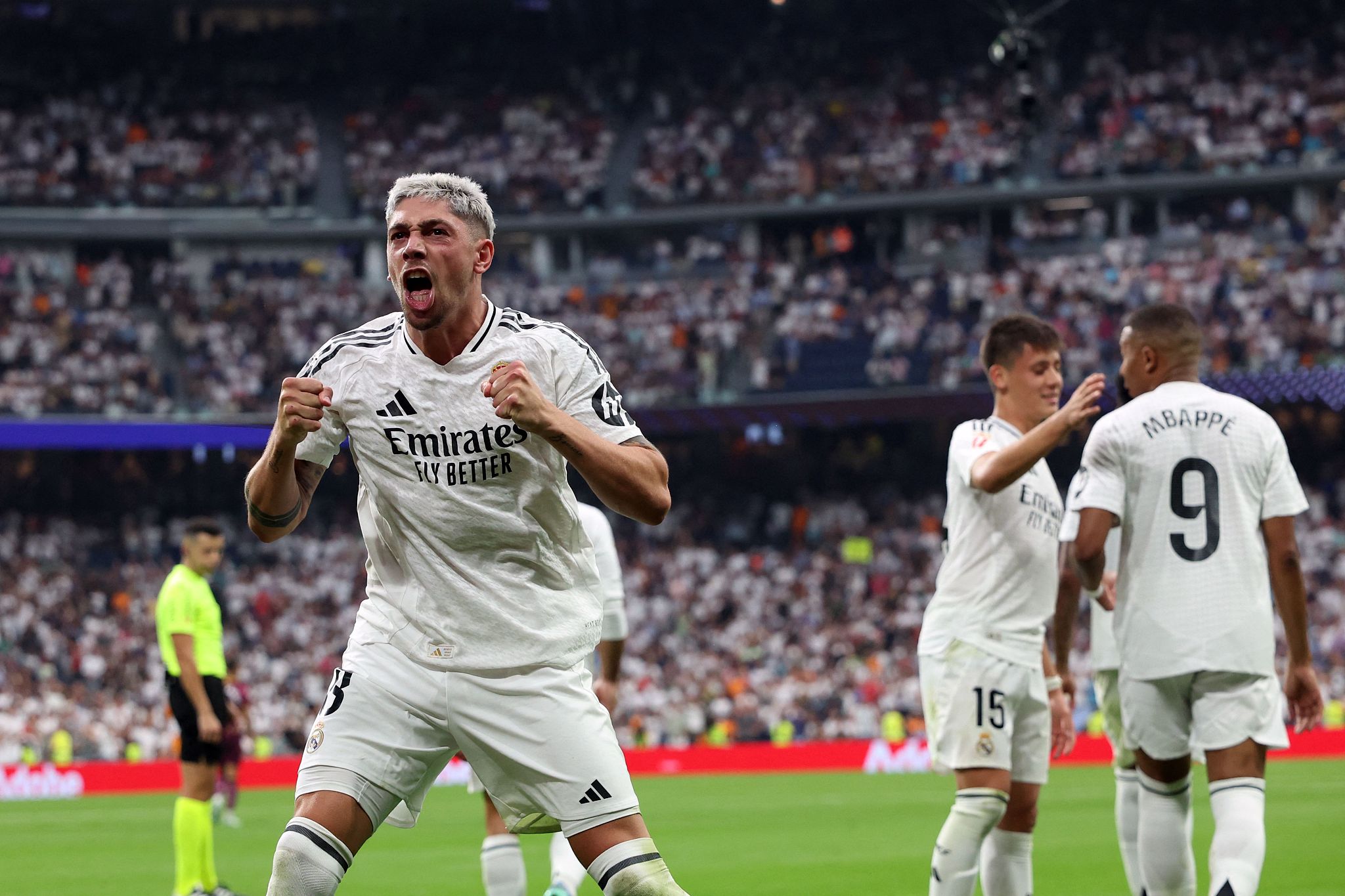 Real Madrid's Federico Valverde (L) celebrates after scoring the opening goal against Real Valladolid in a Spanish La Liga match at the Estadio Santiago Bernabeu in Madrid, Spain, August 25, 2024. /CFP