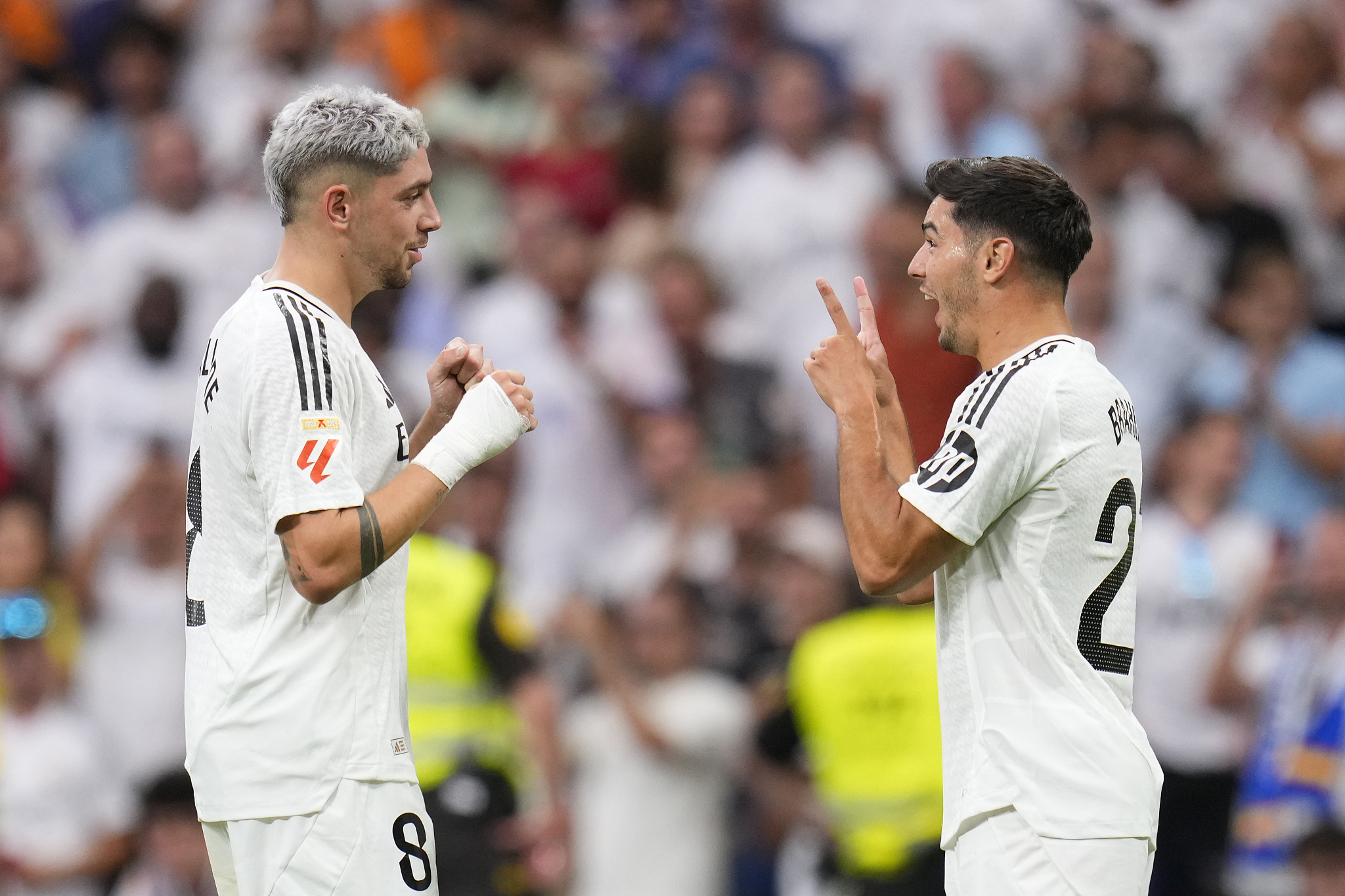 Real Madrid's Brahim Díaz (R) celebrates with Federico Valverde after scoring his side's second goal against Real Valladolid in a Spanish La Liga match at the Estadio Santiago Bernabeu in Madrid, Spain, August 25, 2024. /CFP