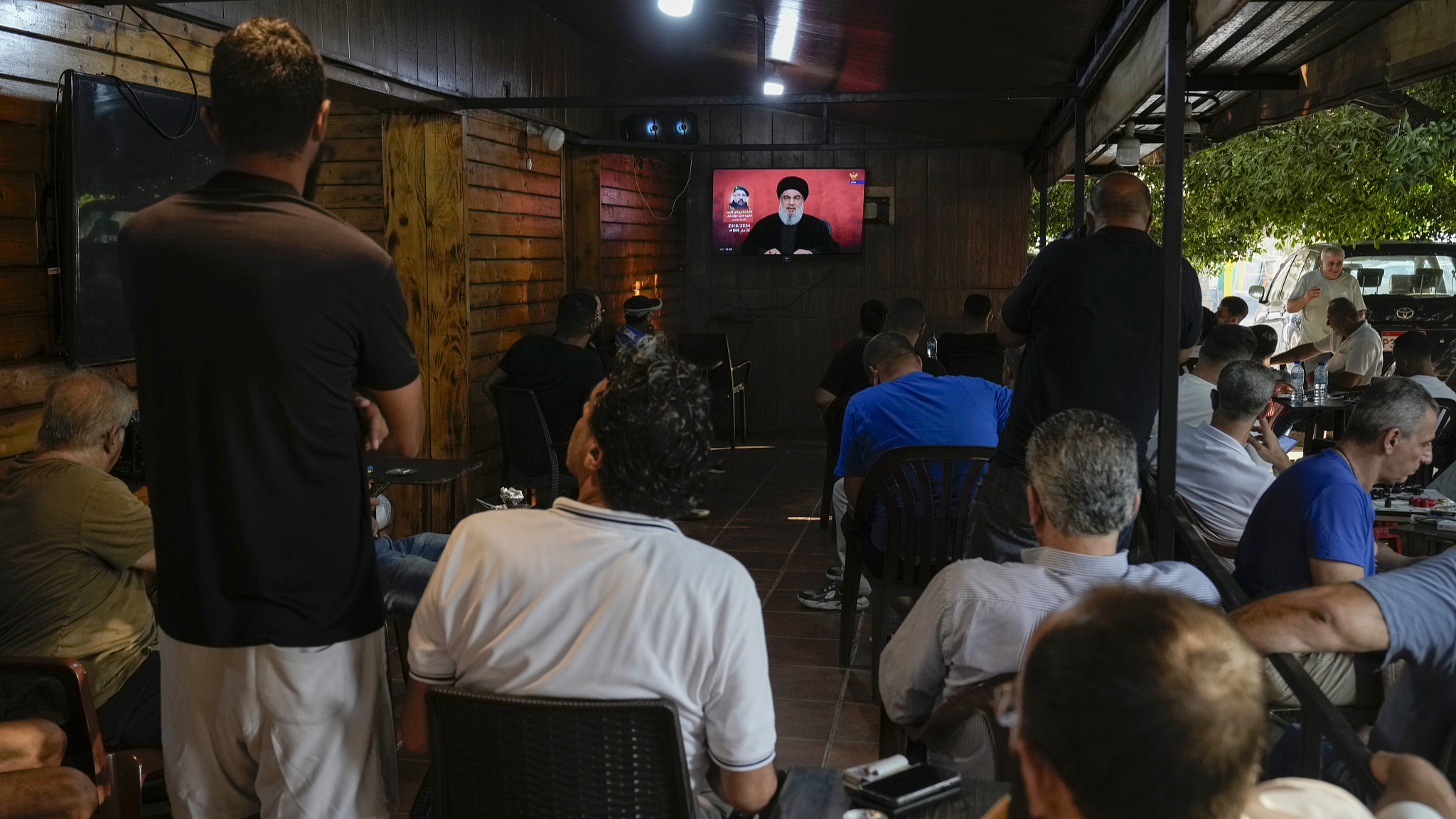 People listen to a speech by Hezbollah leader Sayyed Hassan Nasrallah aired on Hezbollah's al-Manar television channel at a coffee shop in a southern suburb of Beirut, Lebanon, August 25, 2024. /CFP