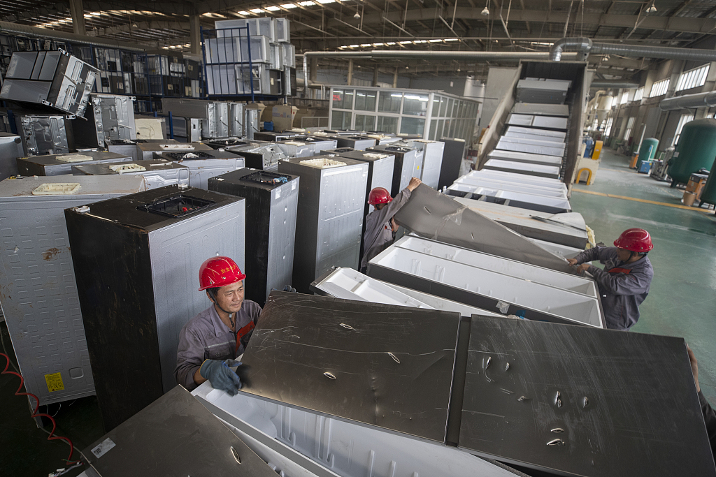 A production line for dismantling used refrigerators is seen in Huangdao district, Qingdao, Shandong Province, July 9, 2024. /CFP