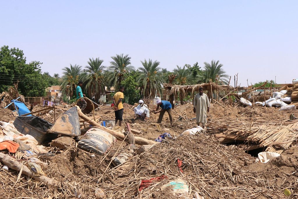 Sudanese people inspect the damage caused by floods in Tangasi Town, Meroe Province, Sudan, August 21, 2024. /CFP