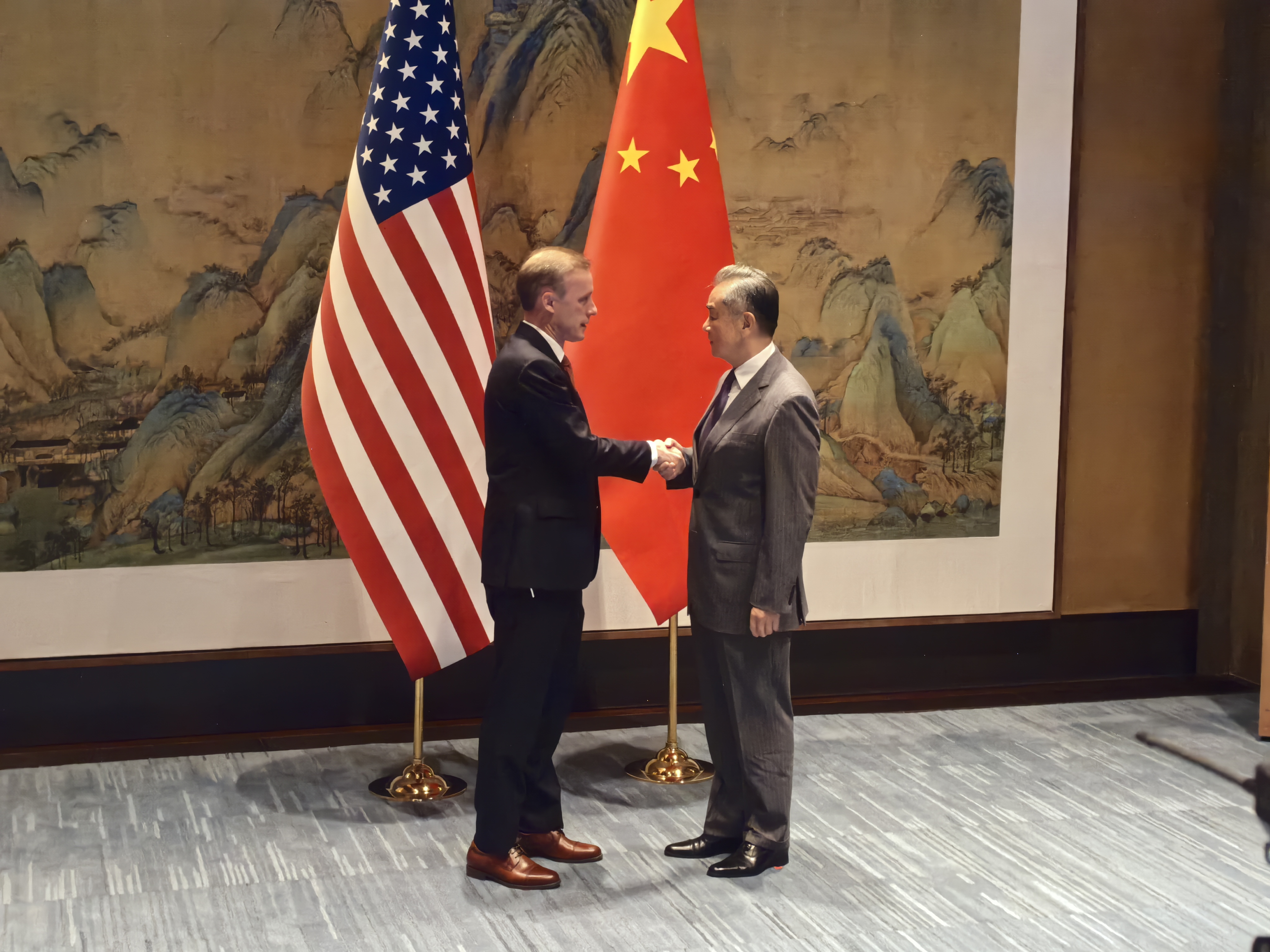 China's Foreign Minister Wang Yi, also a member of the Political Bureau of the Communist Party of China Central Committee and director of the Office of the Central Commission for Foreign Affairs, shakes hands with U.S. National Security Advisor Jake Sullivan in Beijing, China, August 27, 2024. /CGTN