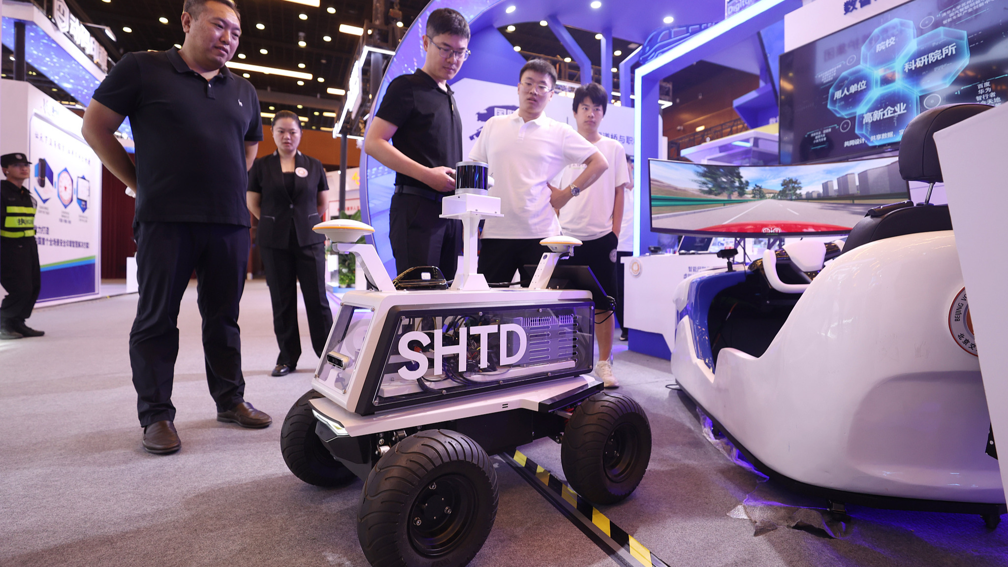 Visitors check out an autonomous driving vehicle at the 2024 Global Digital Economy Conference in Beijing, China, July 5, 2024. /CFP