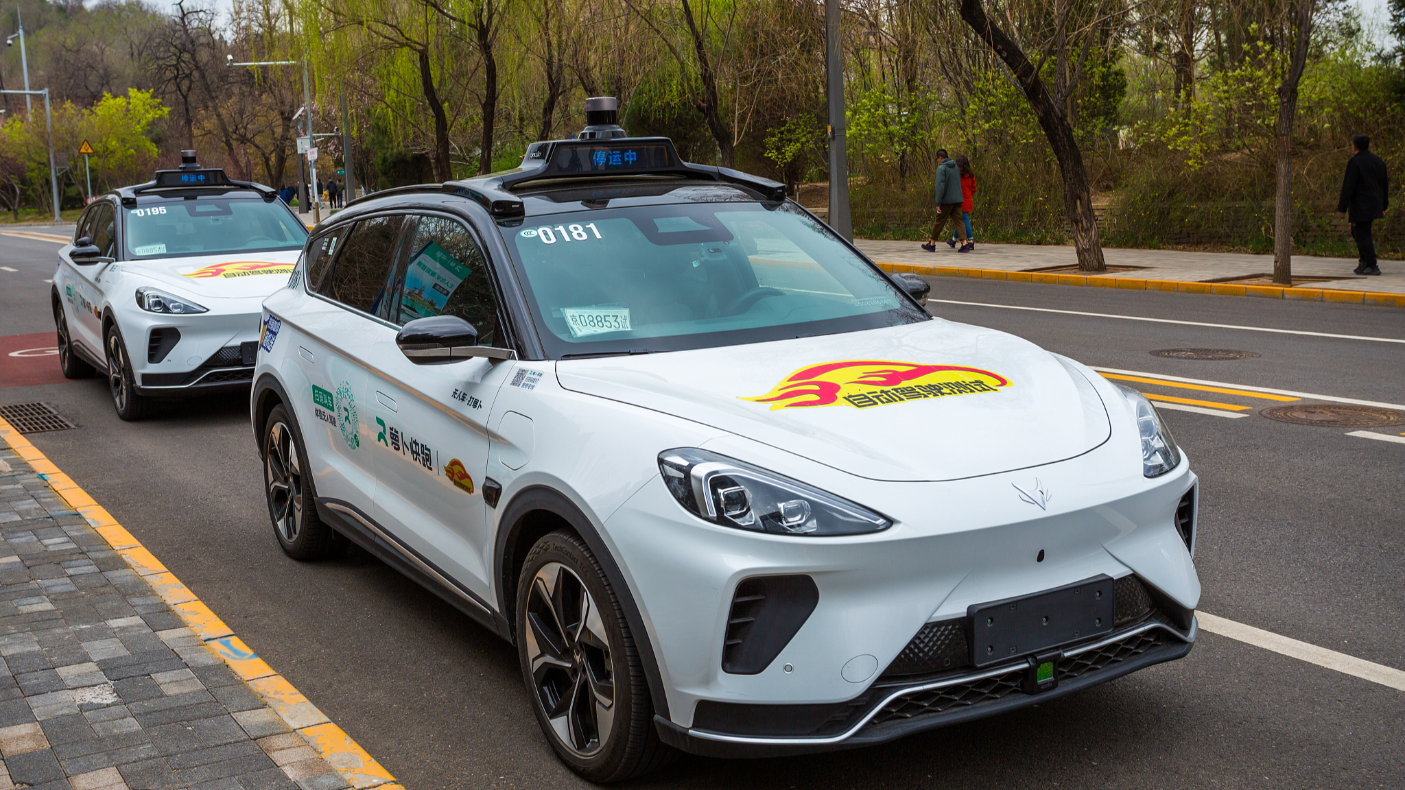 Two driverless vehicles at Shougang Park in Shijingshan District, Beijing, China, April 1, 2024. /CFP