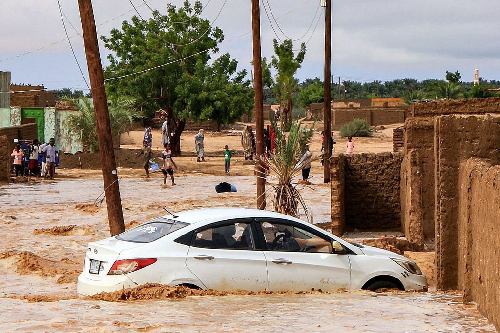 Floodwaters surround a vehicle in the area of Masawi in Sudan's Northern State, August 27, 2024. /CFP