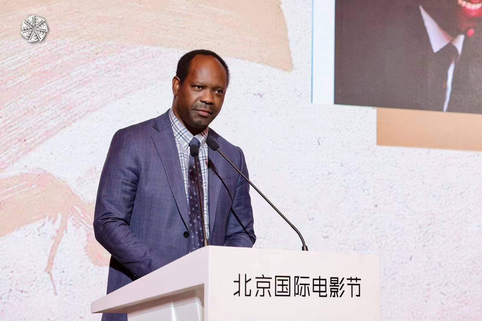 African Film Association in China representative Luc Bendza is seen in a file photo speaking at a conference in Beijing. /BJIFF 