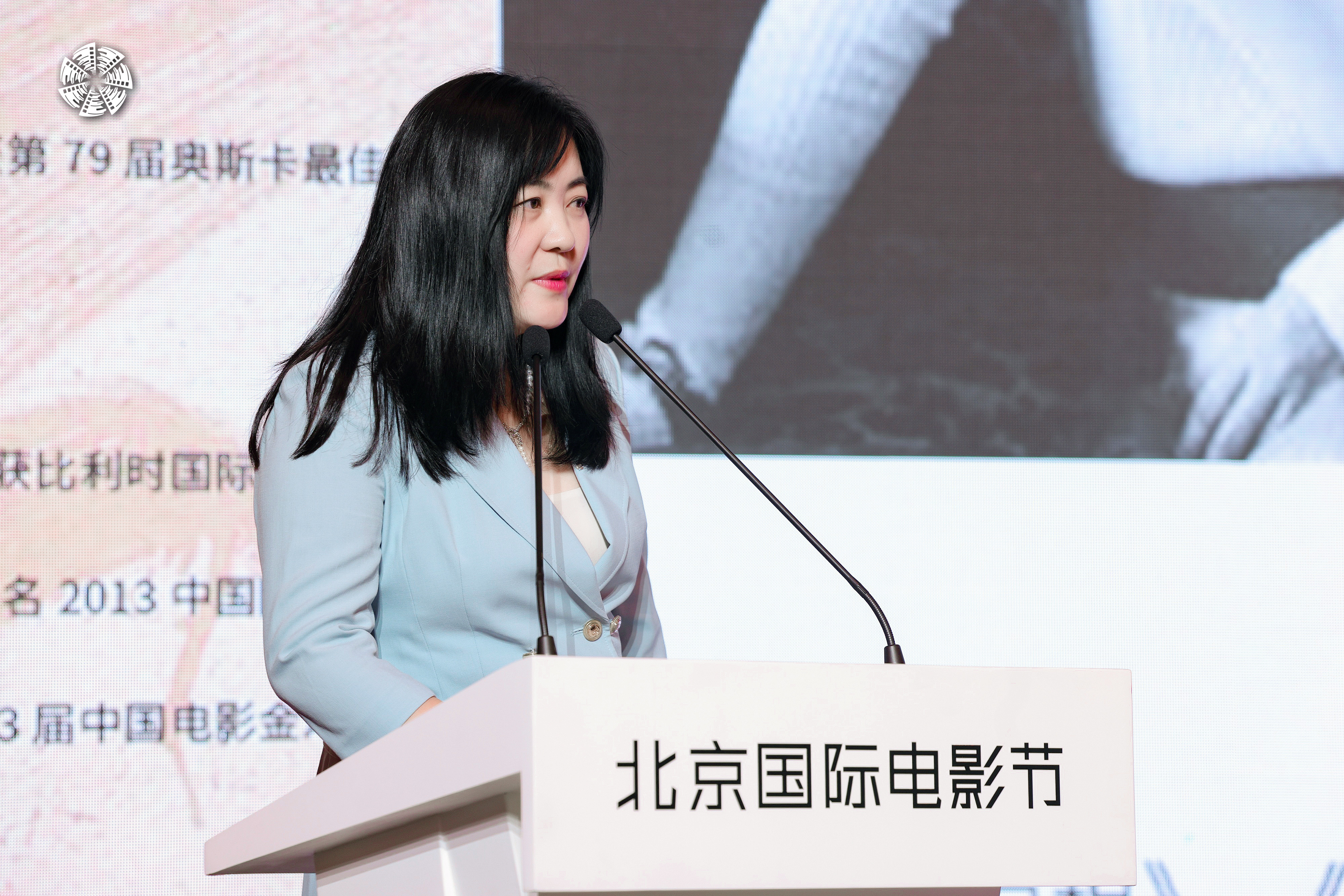 Film director Lu Qingying is seen in a file photo speaking at a conference in Beijing. /BJIFF