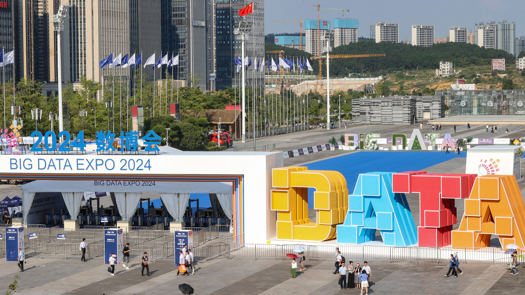 People walk outside the venue of the China International Big Data Industry Expo 2024 in Guiyang City, southwest China's Guizhou Province, August 28, 2024. /CFP