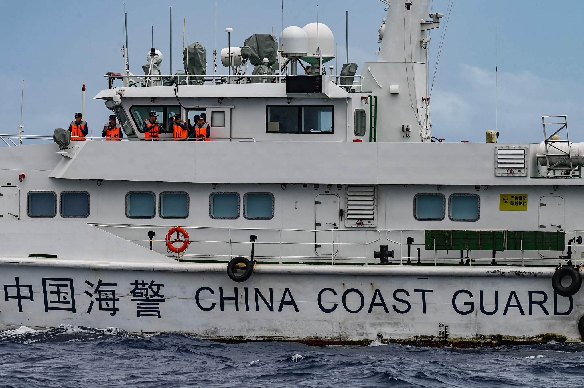 Personnel aboard a China Coast Guard ship are seen in the South China Sea, August 26, 2024. /CFP