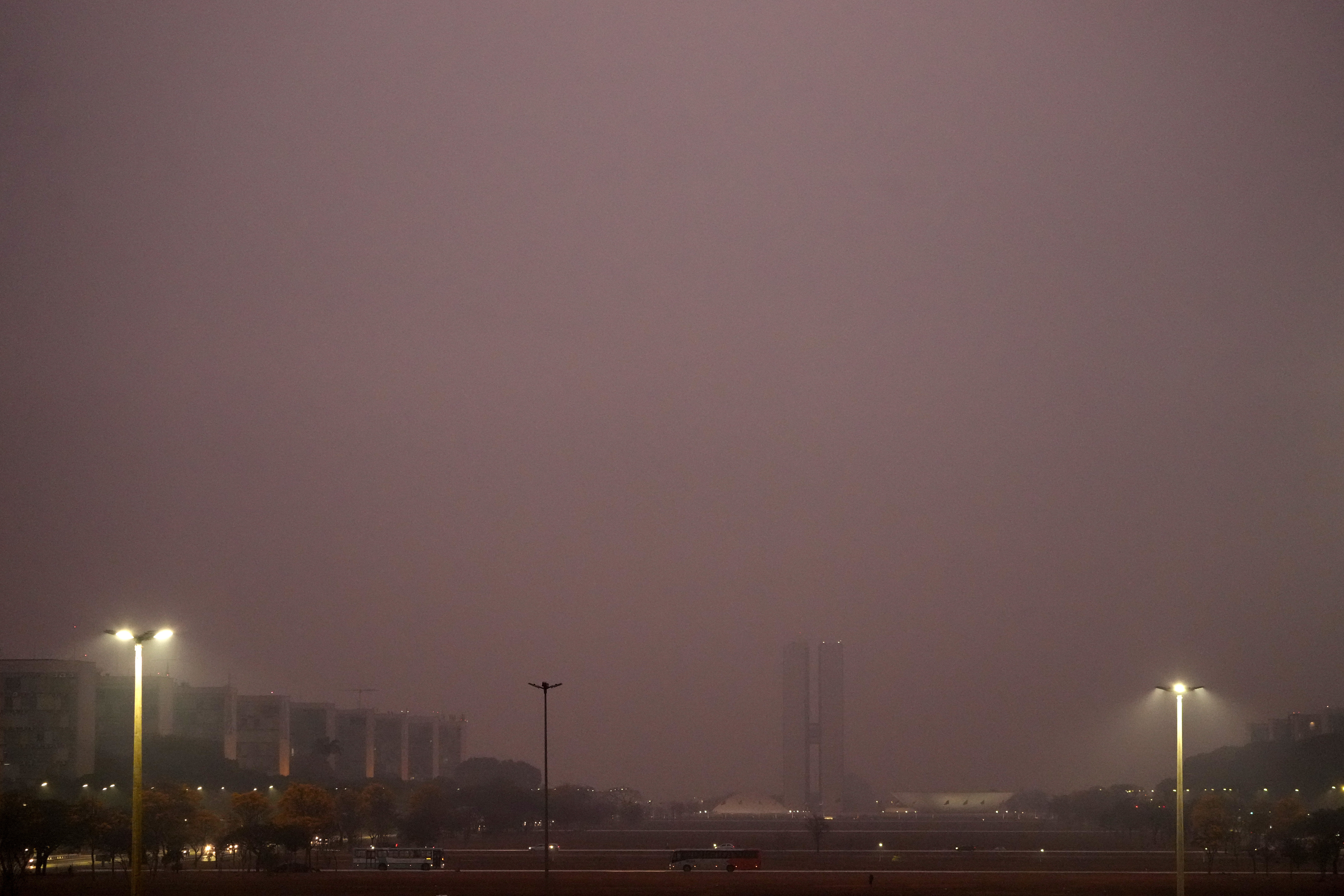 The National Congress is barely visible through smoke from wildfires during dry weather in Brasilia, Brazil, early Monday, August 26, 2024. /AP