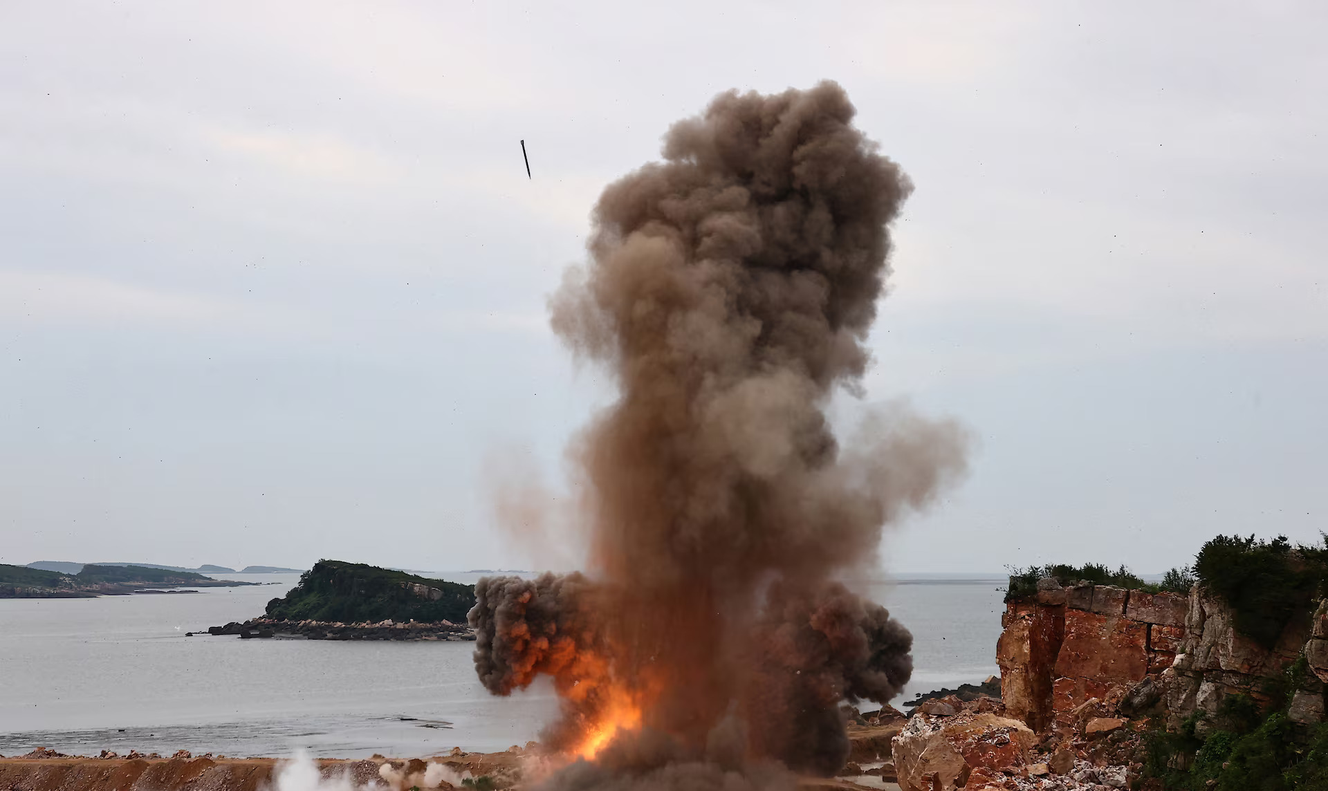 A target explodes during a performance test of an upgraded 240 mm rocket launcher system in the Democratic People's Republic of Korea, in this photo released by the official Korean Central News Agency on August 28, 2024. /Reuters