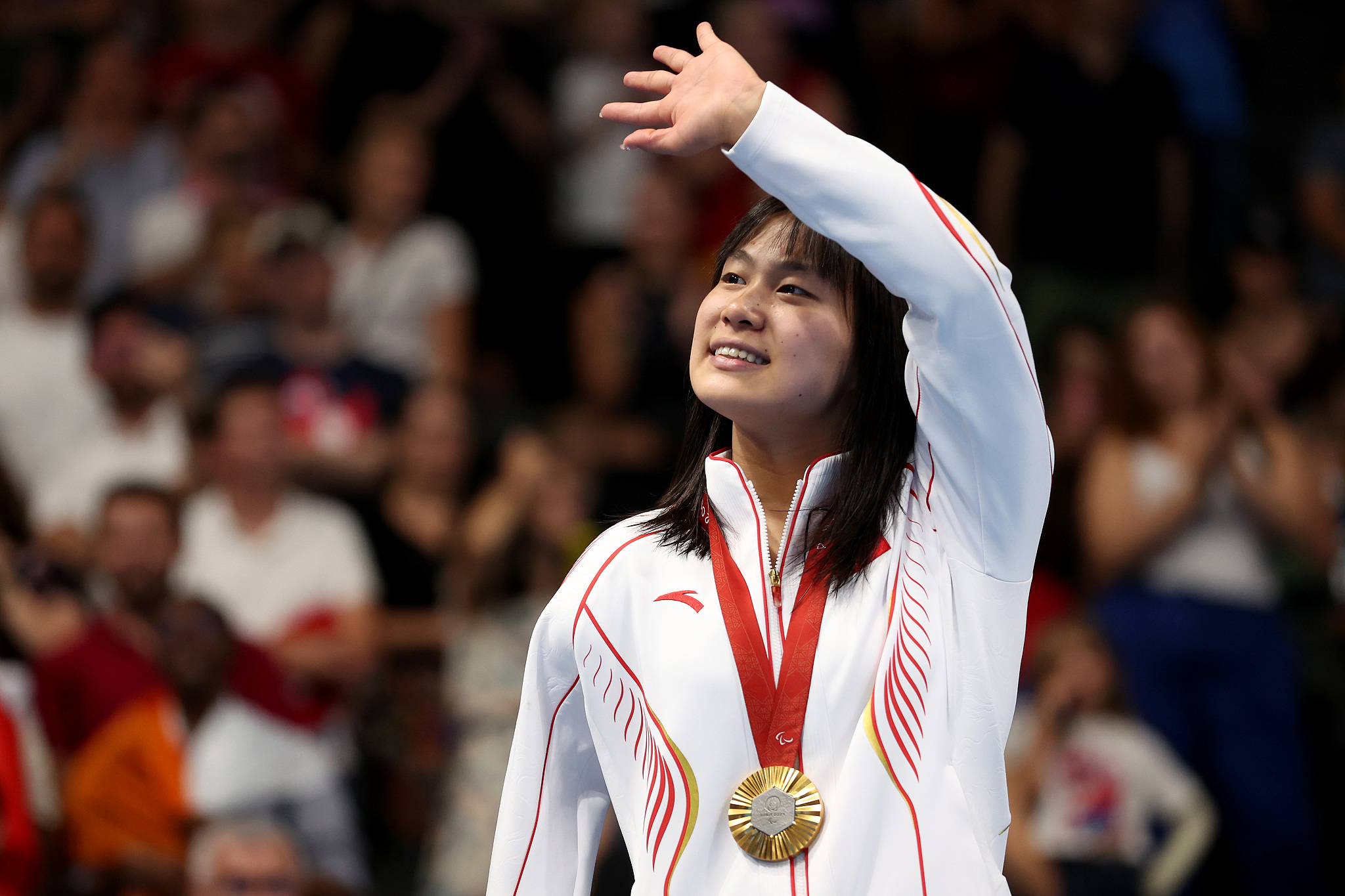 Jiang Yuyan of China celebrates after winning the women's 50-meter freestyle S6 gold medal at the 2024 Summer Paralympic Games in Paris, France, August 29, 2024. /CFP