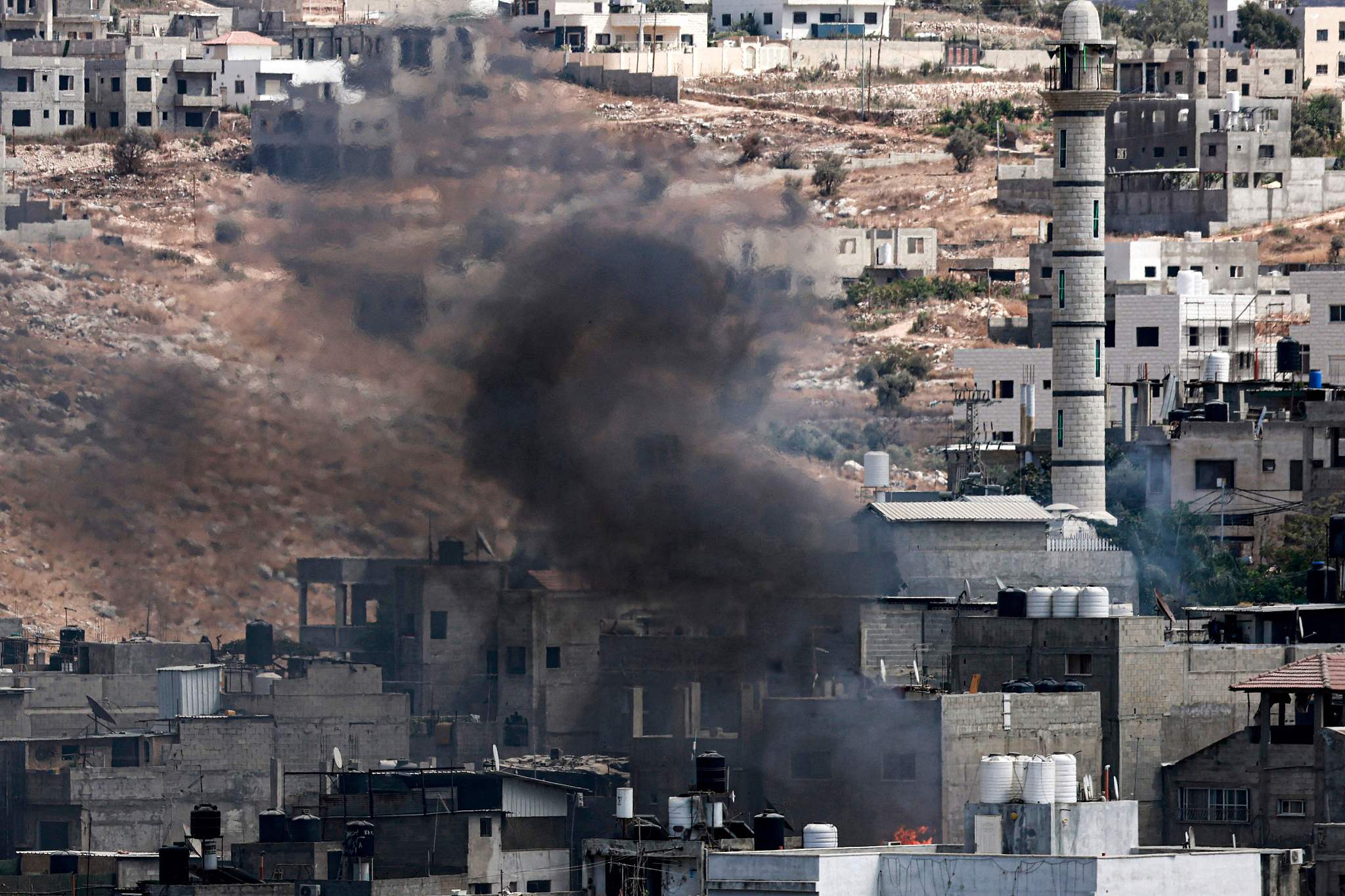 Smoke billows from the Nur Shams refugee camp in Tulkarem during an Israeli army operation in the north of the occupied West Bank, August 29, 2024. /CFP