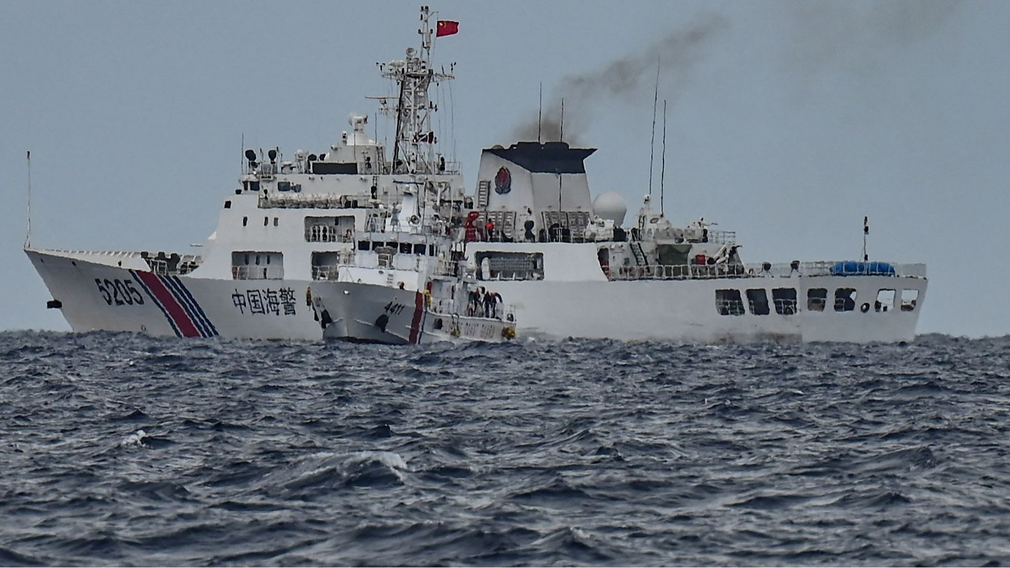 A Philippine Coast Guard ship, during a supply mission to Xianbin Jiao, is stopped by a Chinese Coast Guard ship, in the South China Sea, August 26, 2024. /CFP