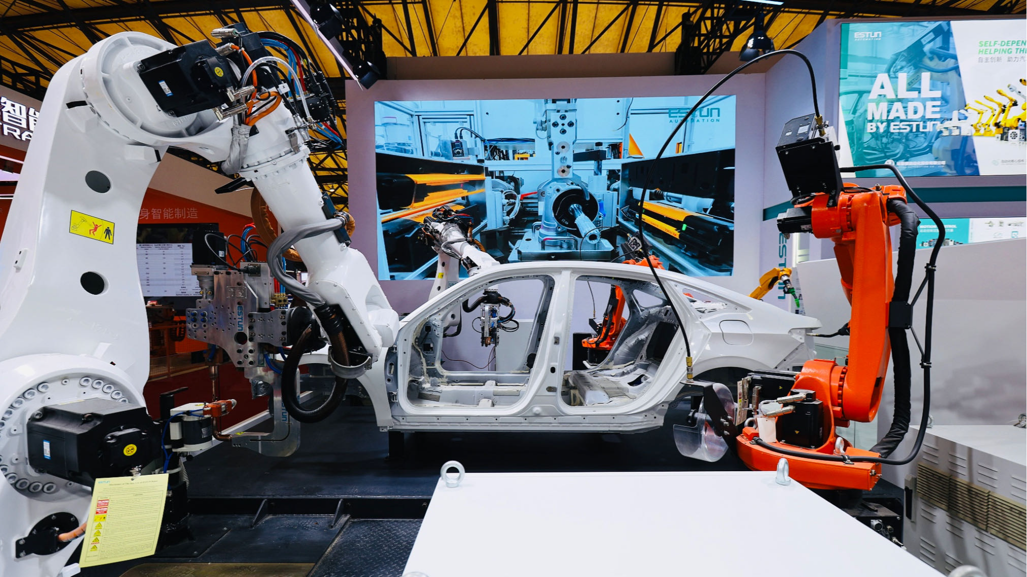 ESTUN Automation Industrial robots weld at Shanghai International Automobile Manufacturing Technology and Equipment and Materials Exhibition 2024, in Shanghai Municipality, east China, July 5, 2024. /CFP