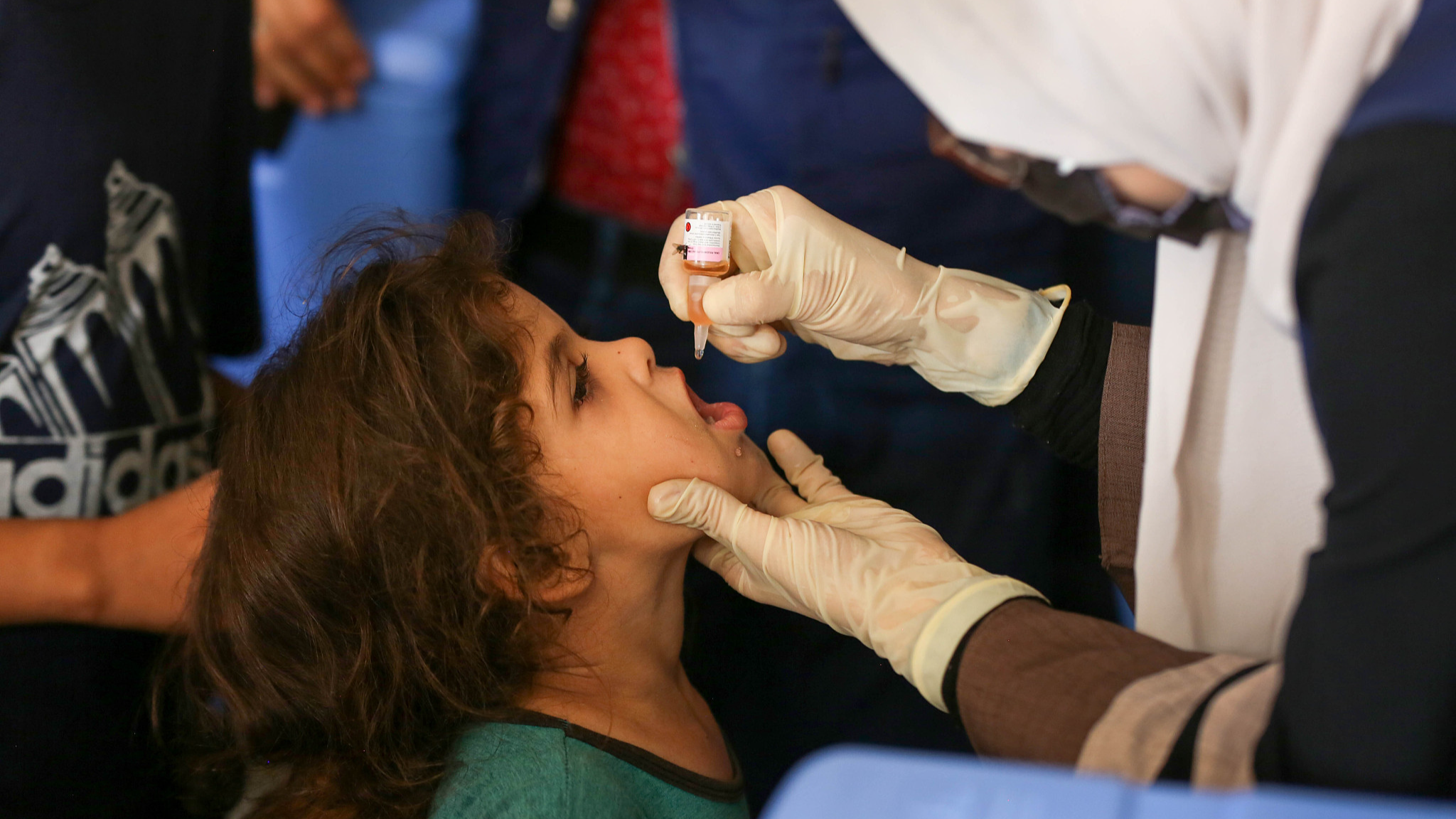 A child is vaccinated against polio in Deir al Balah, Gaza, September 1, 2024. /CFP