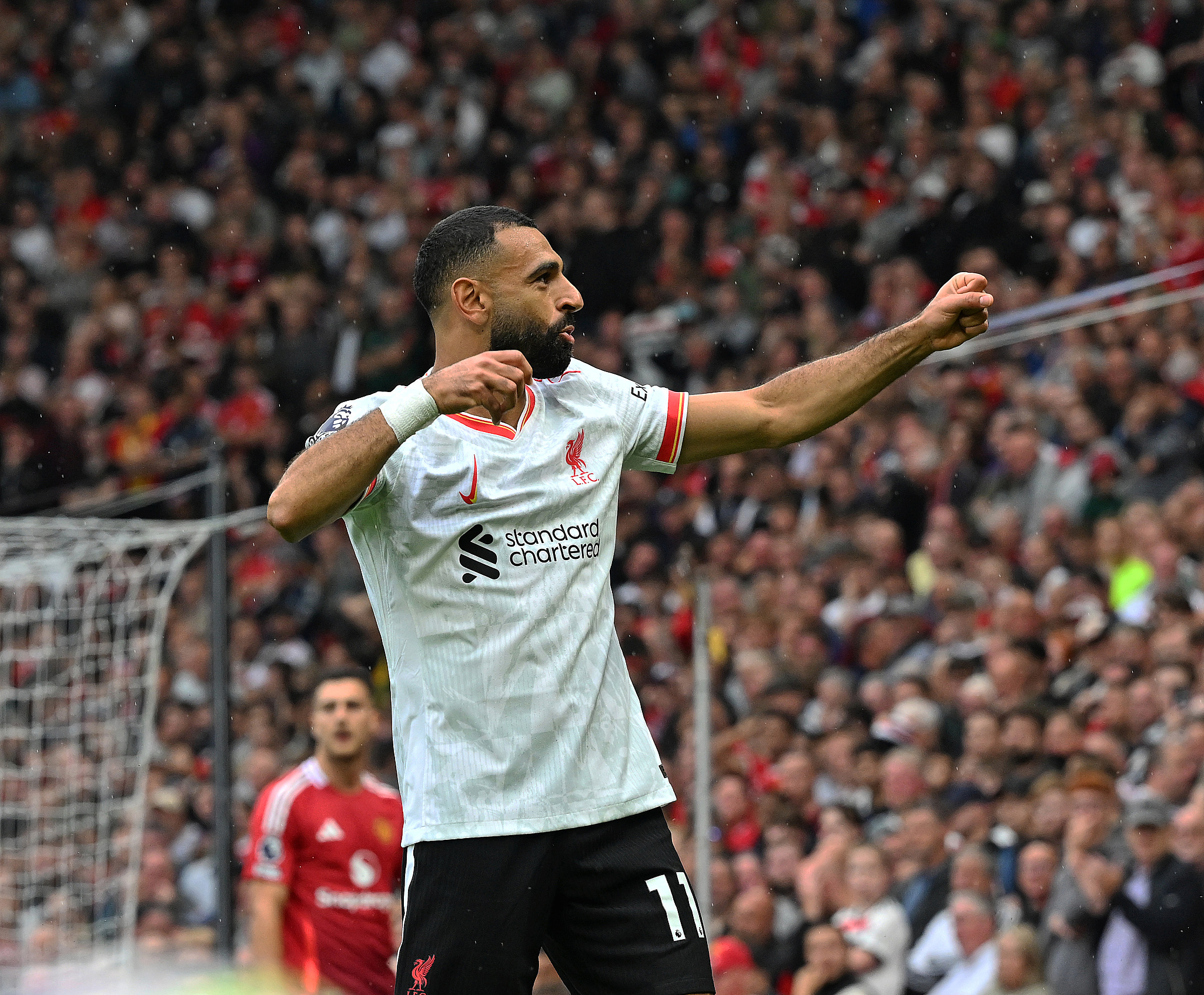 Mohamed Salah (#11) of Liverpool celebrates after scoring a goal in the Premier League game against Manchester United at Old Trafford in Manchester, England, September 1, 2024. /CFP