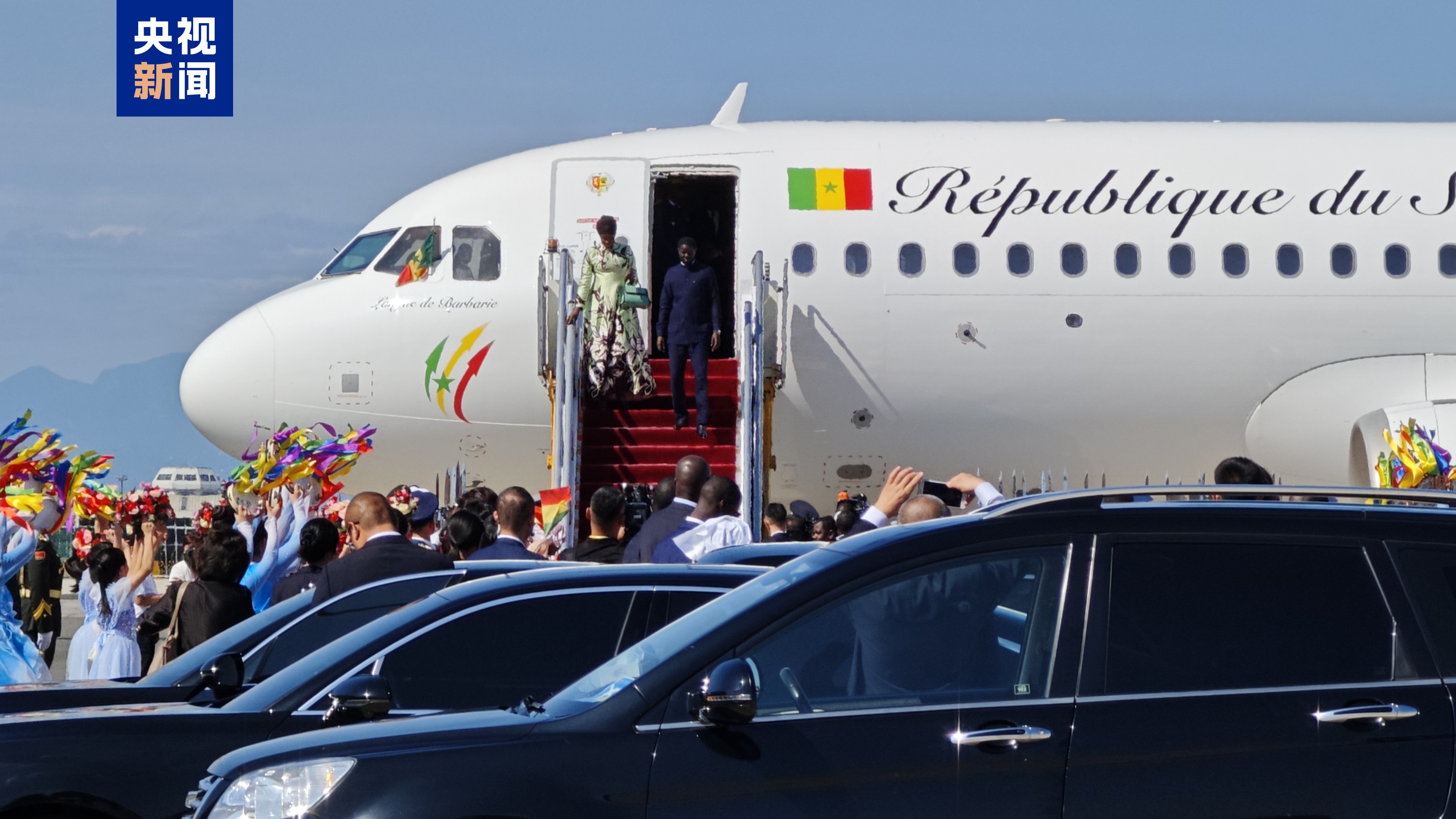 President Bassirou Diomaye Faye of Senegal and his wife walk down the plane after arriving in Beijing, capital of China, September 2, 2024. /CMG