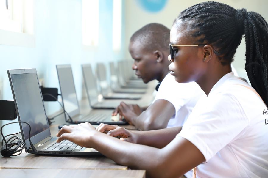 Young people attend a digital training program provided by Huawei DigiTruck in the Katakwi District of eastern Uganda, January 30, 2024. /Xinhua