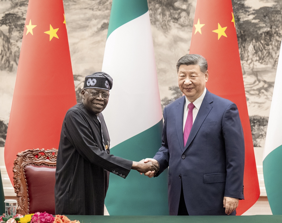 Chinese President Xi Jinping shakes hands with Nigerian President Bola Tinubu at the Great Hall of the People in Beijing, capital of China, September 3, 2024. /Xinhua