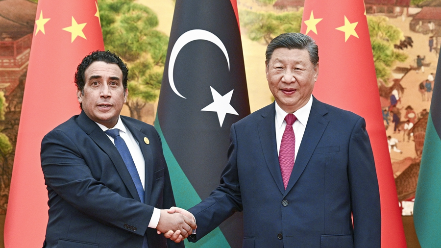 Chinese President Xi Jinping (R) shakes hands with President of the Libyan Presidential Council Mohammad Younes Menfi, who is in Beijing for the 2024 Summit of the Forum on China-Africa Cooperation (FOCAC), in Beijing, China, September 4, 2024. /Xinhua