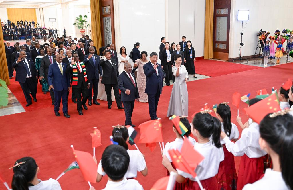 International guests attending the 2024 Summit of the Forum on China-Africa Cooperation are greeted by children on their way to a welcome banquet held by Chinese President Xi Jinping and his wife Peng Liyuan at the Great Hall of the People in Beijing, capital of China, September 4, 2024. /Xinhua