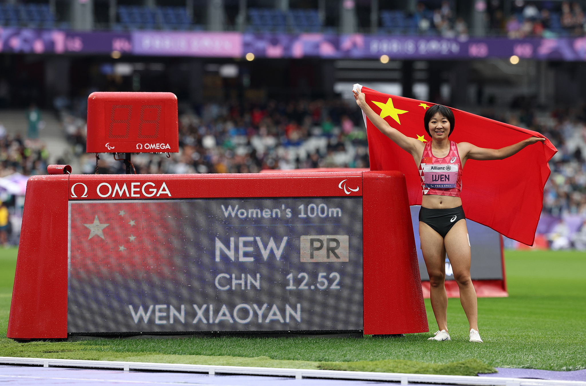 Wen Xiaoyan of China celebrates after setting the women's 100-meter T37 world record to win the event's final in 12.52 seconds at the 2024 Summer Paralympic Games in Paris, France, September 5, 2024. /CFP