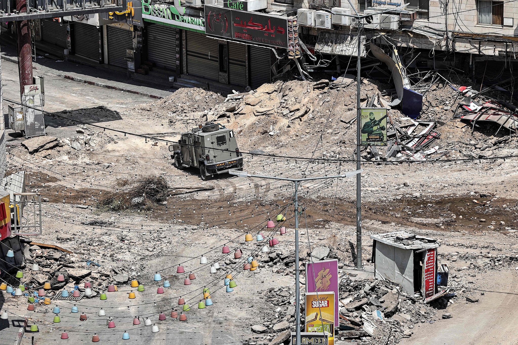 Israeli army armored vehicles move along an excavated section of a road in the center of Jenin in the occupied West Bank, September 5, 2024. /CFP