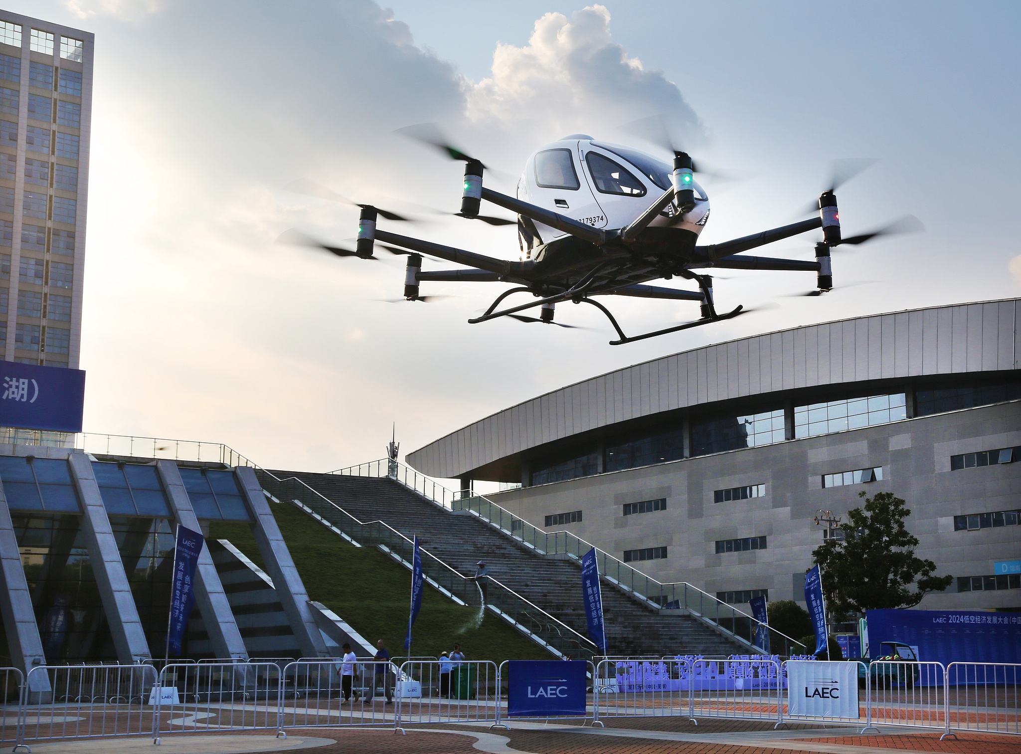 Exhibitors showcase the EH216-S passenger-carrying autonomous aerial vehicle at the 2024 Low-Altitude Economic Development Conference in Wuhu, Anhui Province, China, September 5, 2024. /CFP