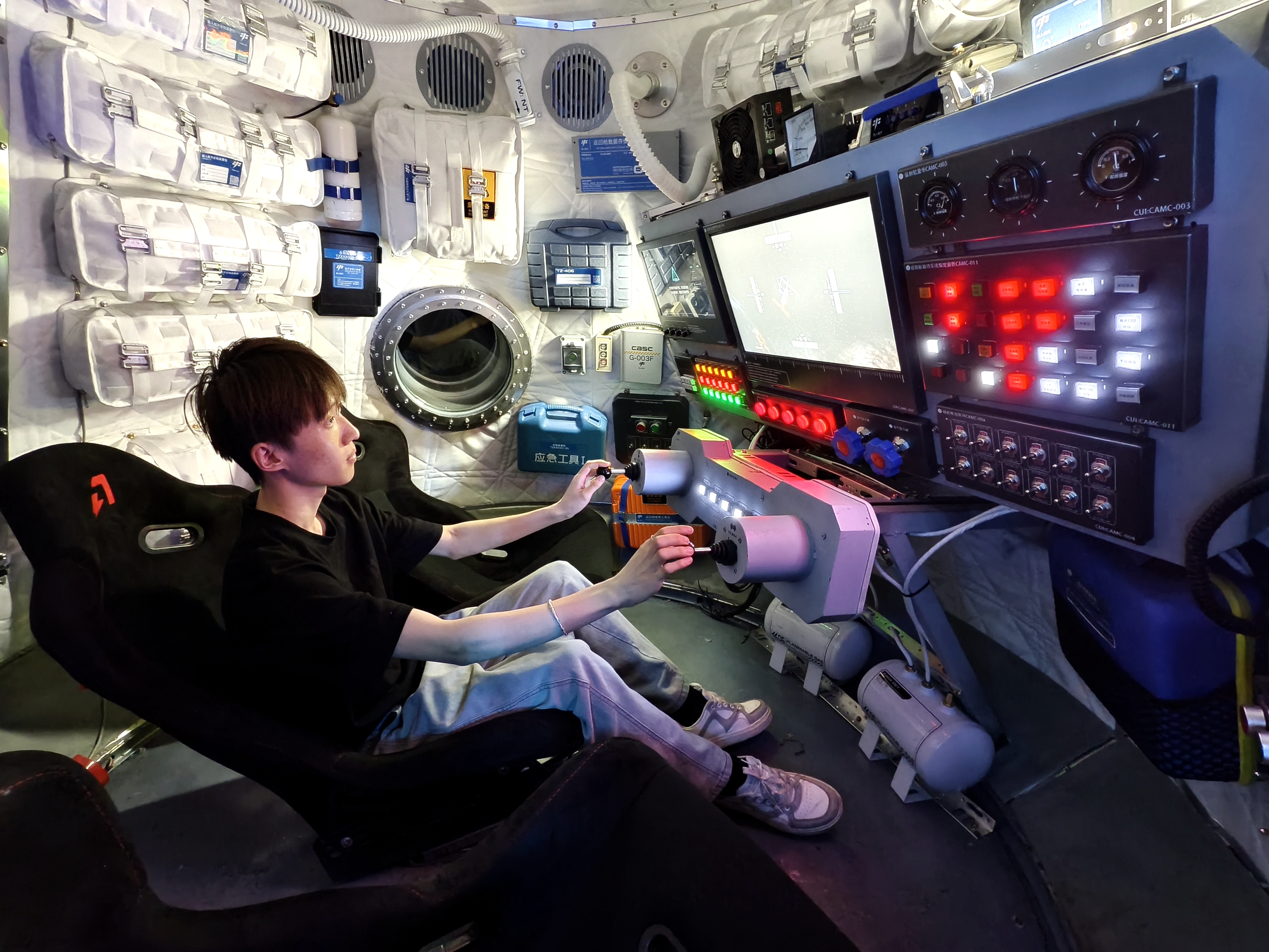 A man experiences the high-tech facilities in Shougang No.1 Blast Furnace - SoReal Science Fiction Paradise in western Beijing's Shougang Park. /IC