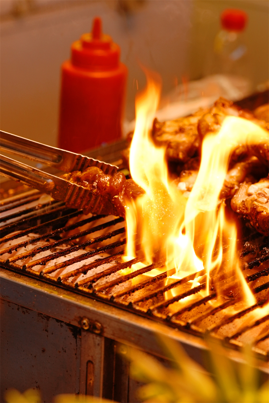 Almost cooked BBQ treats tempt passers-by with their mouthwatering aroma at the night market in Shenyang, Liaoning Province, August 19, 2024. /CGTN