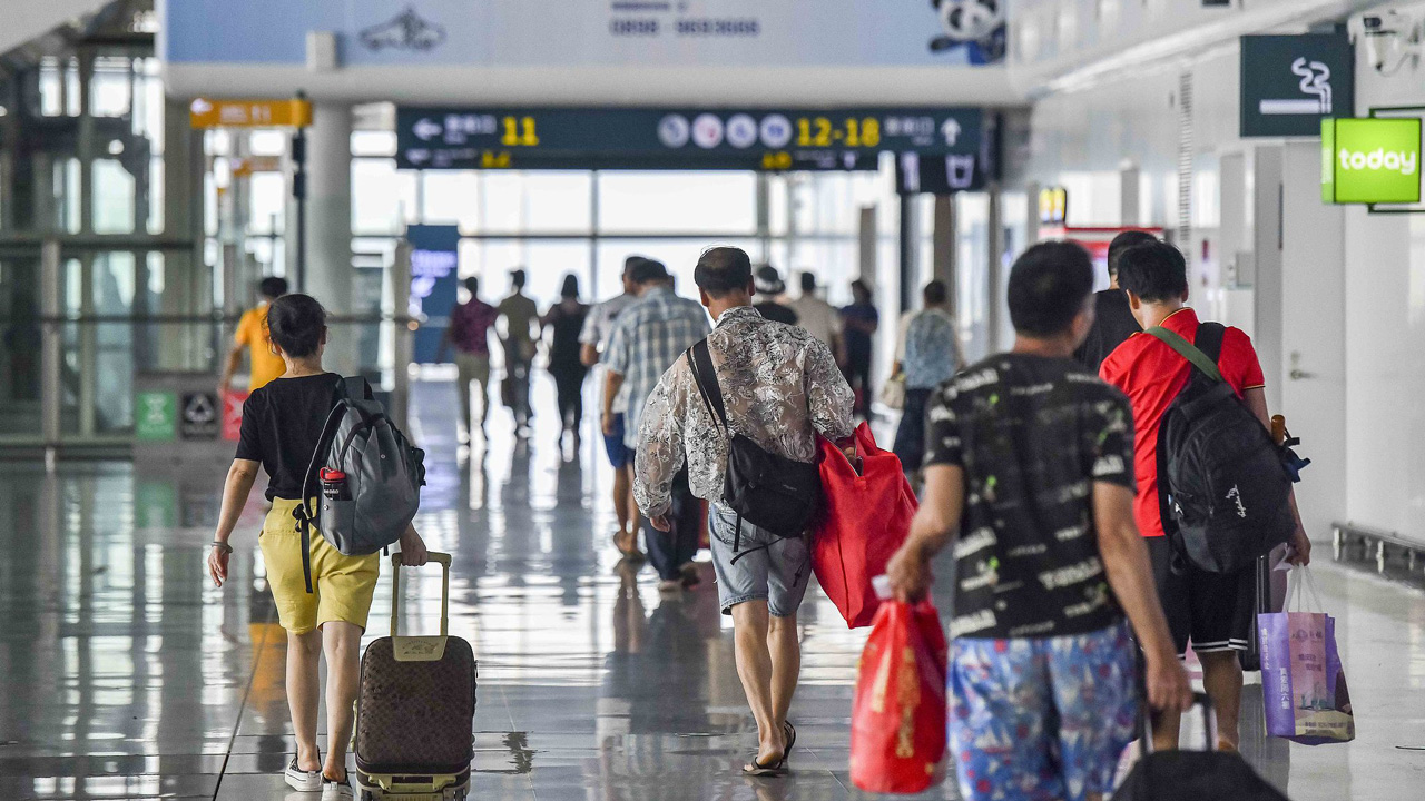 Passengers walk into the waiting hall as service restored in Haikou Port New Seaport, south China's Hainan, September 8, 2024. /CFP