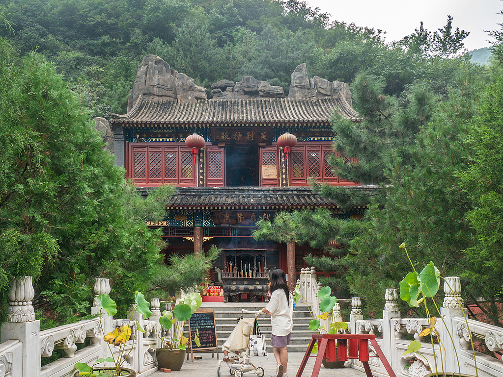 A woman visits Baipu Temple in Beijing's Mentougou District on August 31, 2024. /CFP 