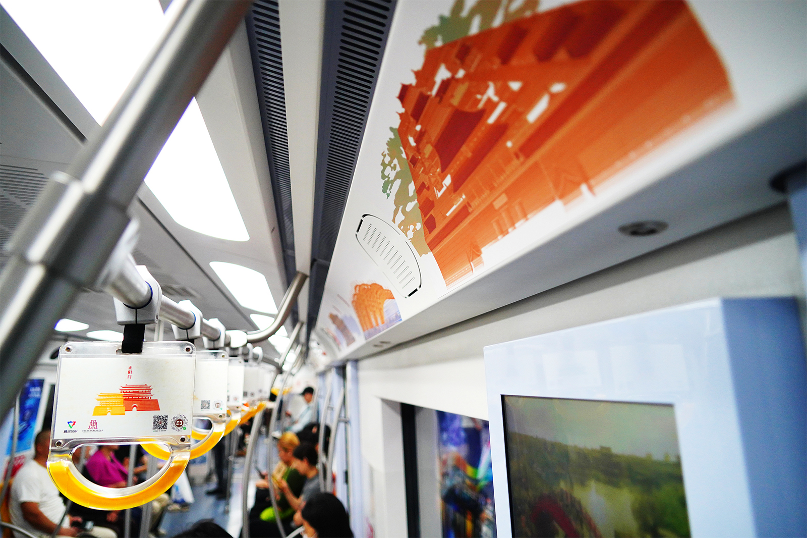 The unique designs featuring the heritage sites along the Beijing Central Axis are seen inside the special themed subway train in Beijing on September 9, 2024. /CFP